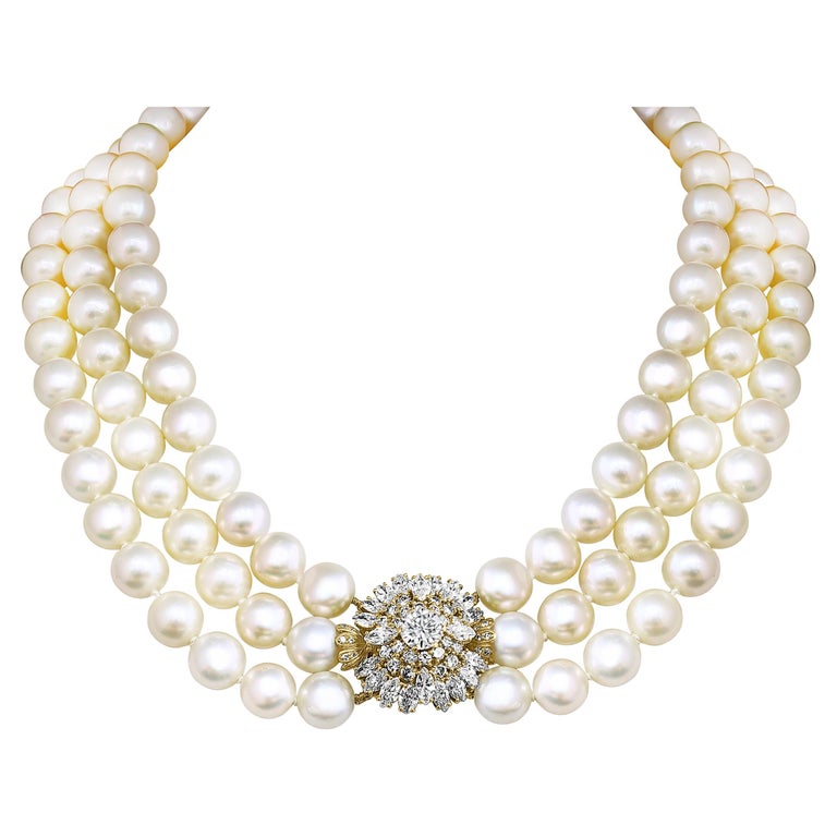 
Cartier South Sea Three Layer Pearl Necklace with 7 ct of total diamonds Clasp which has a 1.6 Ct Solitaire Diamond 
Serial # is stamped 32527K , 750  is stamped and Cartier is stamped 
Quality and color is extreme fine
This exceptional South Sea