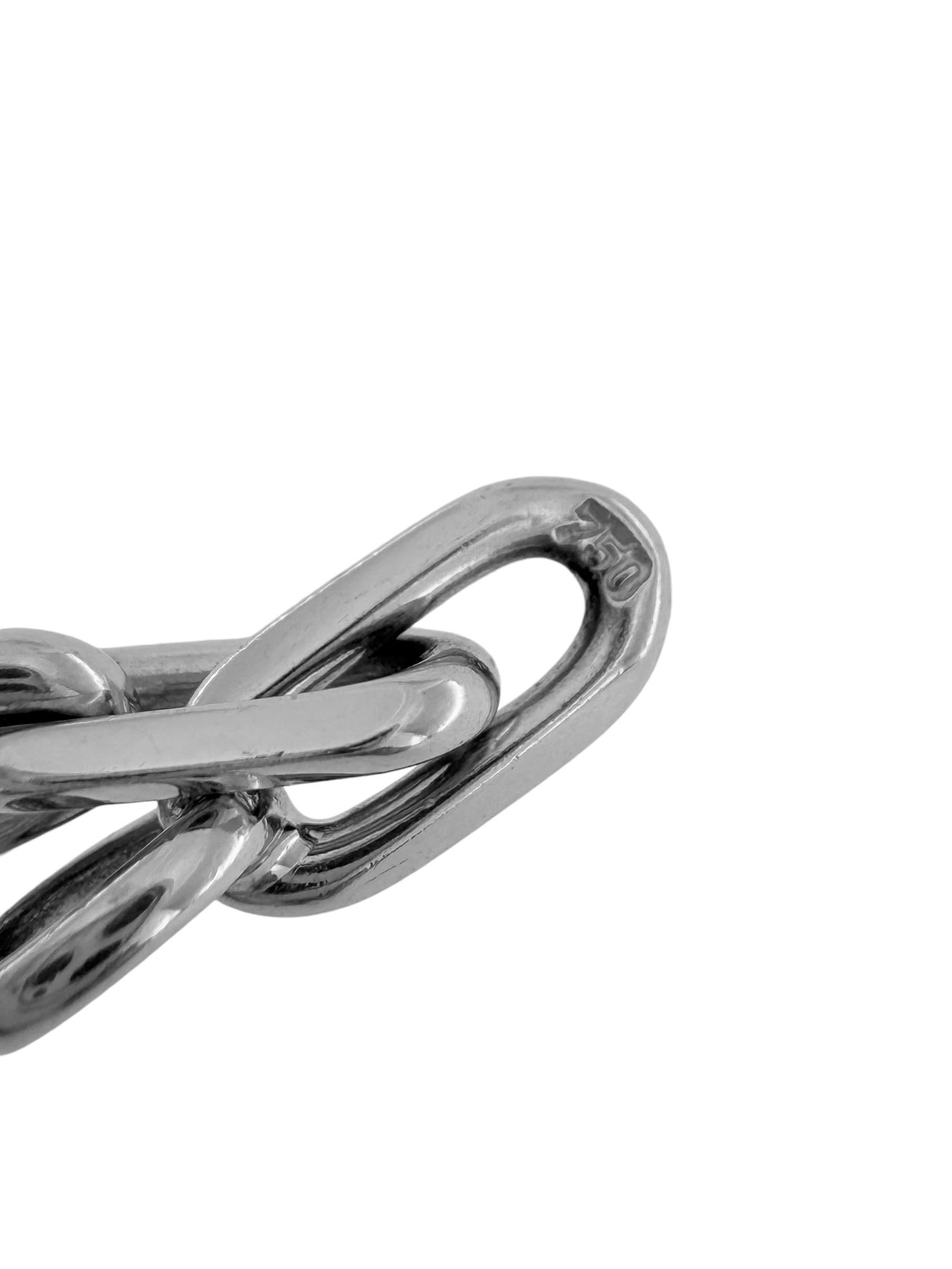 The Cartier Spartacus White Gold Necklace is an exceptional piece that exemplifies Cartier's commitment to fine craftsmanship and timeless elegance. Crafted in 18kt white gold, the design features bold oval links, seamlessly interlocked to create a