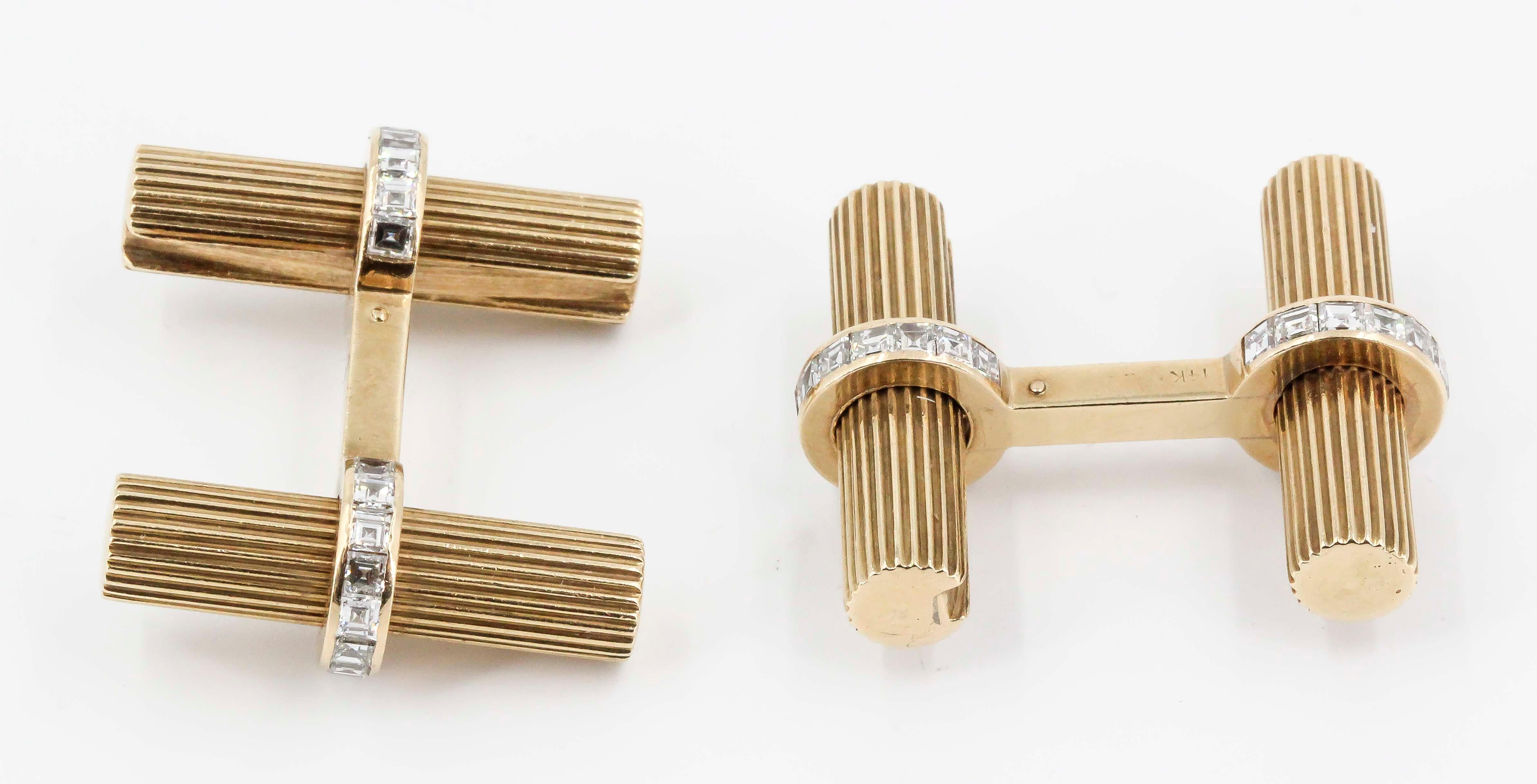 Handsome 14K yellow gold and diamond bar cufflinks and tie bar set by Cartier, circa 1950s. They feature high grade square cut diamonds, approx. 1.50 cts total weight. Cufflinks are 1