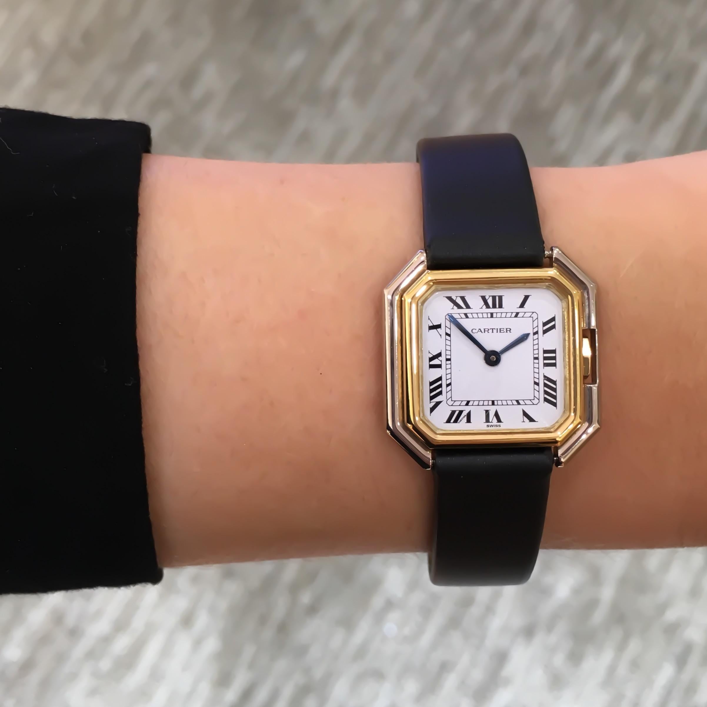 Cartier Square Hexagonal Godron 18K Two-Tone Mechanical Watch Fabric Strap

MOVEMENT: MECHANICAL HAND-WINDING
CASE MATERIAL: 18 KARAT WHITE AND YELLOW GOLD
CONDITION: EXCELLENT PRE-OWNED WITH MINOR SCRATCHES ON  CRYSTAL. NEW STRAP.
CASE