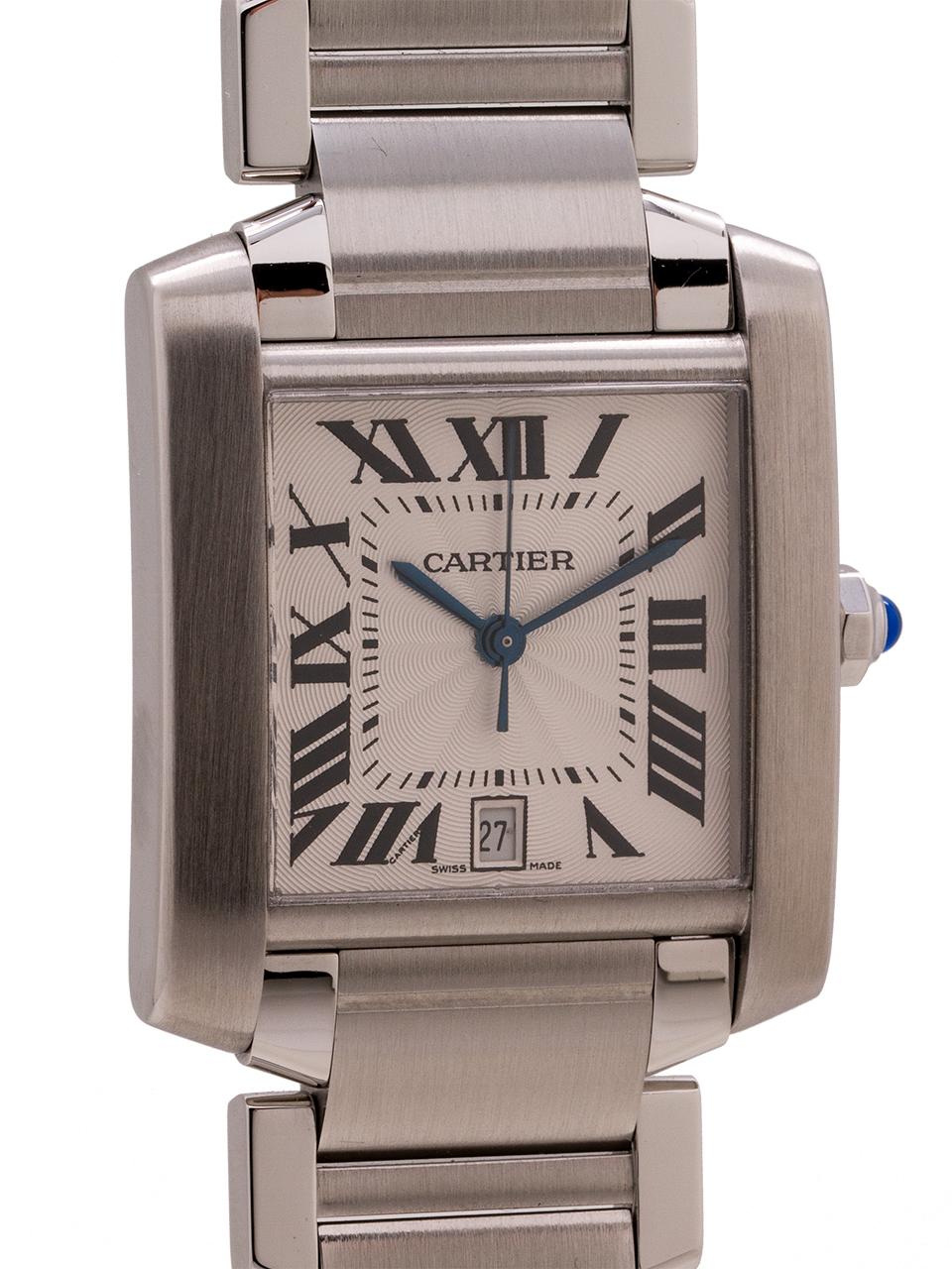 
Cartier Man’s stainless steel Tank Francaise automatic case ref 2302 circa 2000’s. Man’s model 28 x 42mm featuring guilloche textured matte silver satin dial with black Roman figures, blued steel hands, and cabochon sapphire crown. Powered by self