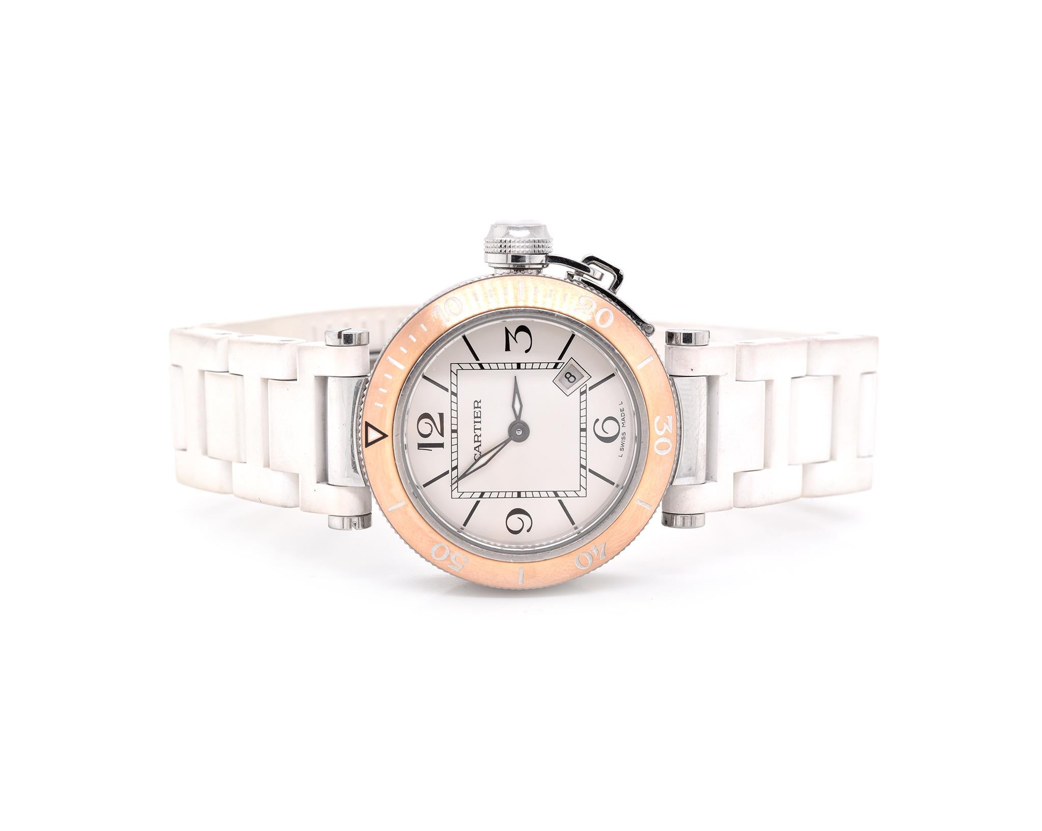 Movement: quartz
Function: hours, minutes, date
Case: 33mm stainless steel & 18K rose gold case, push pull crown, sapphire crystal
Dial: white dial, black transferred Roman numerals, and steel sword-shaped hands
Band: white Cartier rubber strap,