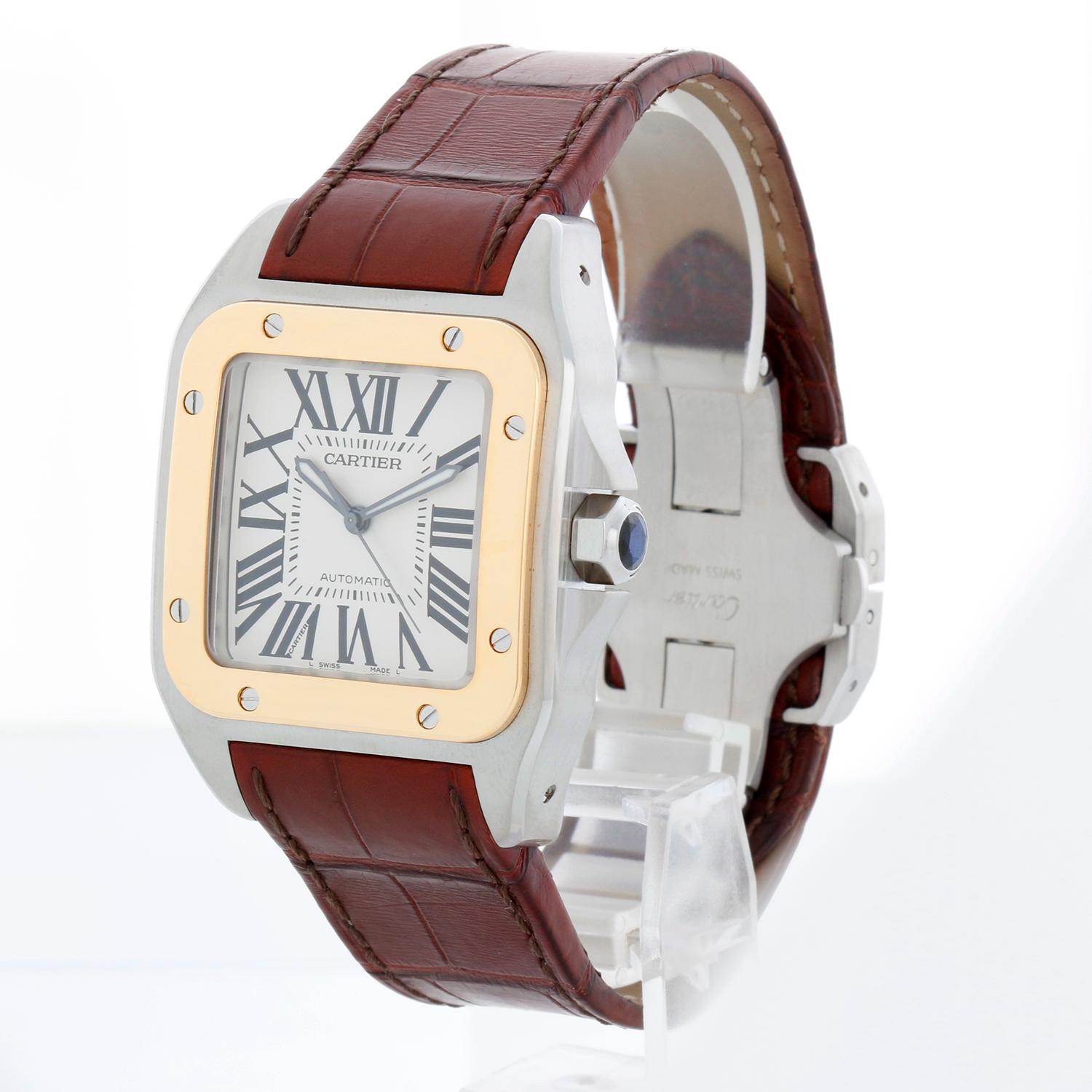 Reloj Cartier Santos 100 de acero inoxidable y oro amarillo de 18 quilates para hombre W20072X7 2656 - Automático. Santos 100. Acero inoxidable con bisel de oro amarillo de 18 quilates ( 38 x 51 mm ). Esfera plateada con índices romanos. Correa de