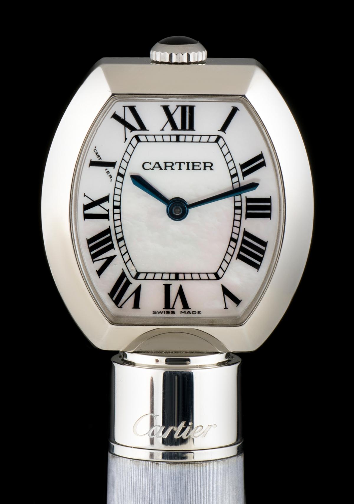 This stainless steel Ball Point Pen 22.5mm watch, by Cartier, is one of 2000 pieces ever manufactured and sold worldwide. 

The stainless steel pen case is finished with grey lacquer and platinum. At the top of the pen is a small quartz clock,