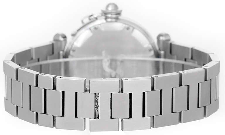 Ref. W31074M7. Automatic movement. Stainless steel case, 35mm, circa 1990s. White dial with gold markers and black Arabic numerals, date between 4 and 5 o'clock. Stainless steel Pasha bracelet. Pre-owned with custom box.
