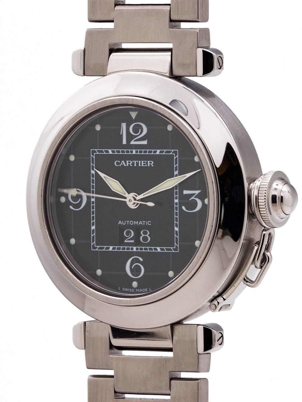 
Cartier Stainless Steel Pasha C ref 2475. 35.5 x 42 diameter case with smooth bezel, sapphire crystal and stainless steel screw down canteen style crown protector. Newer style so called “big date” window. Featuring original black dial with large