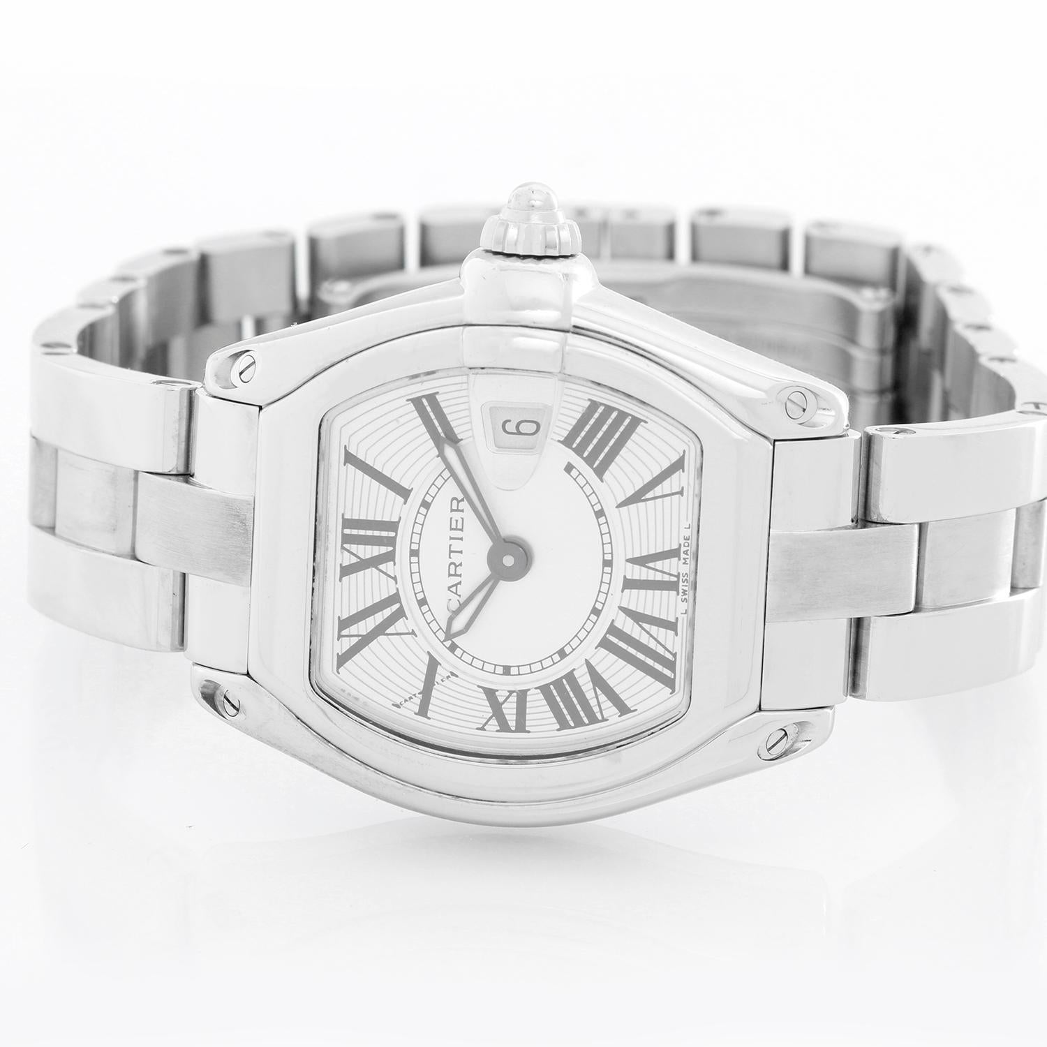 Cartier Stainless Steel Roadster W62016V3 - Quartz. Stainless steel tonneau style case. Silver guilloche dial with black Roman numerals; date at 3 o'clock. Stainless steel Cartier bracelet with deployant clasp. Pre-owned with Custom box and papers.