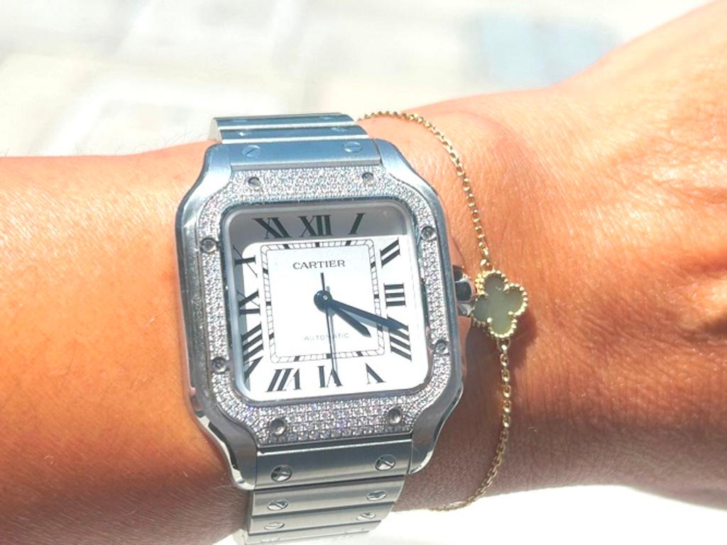 Cartier Santos De Cartier W/ Pave Bezel 

1904, Louis cartier granted wish of the famous Brazilian aviator Alberto Santos Dumont: to be able to tell time while flying. The birth of one of the first ever wristwatches sealed the bonds of friendship