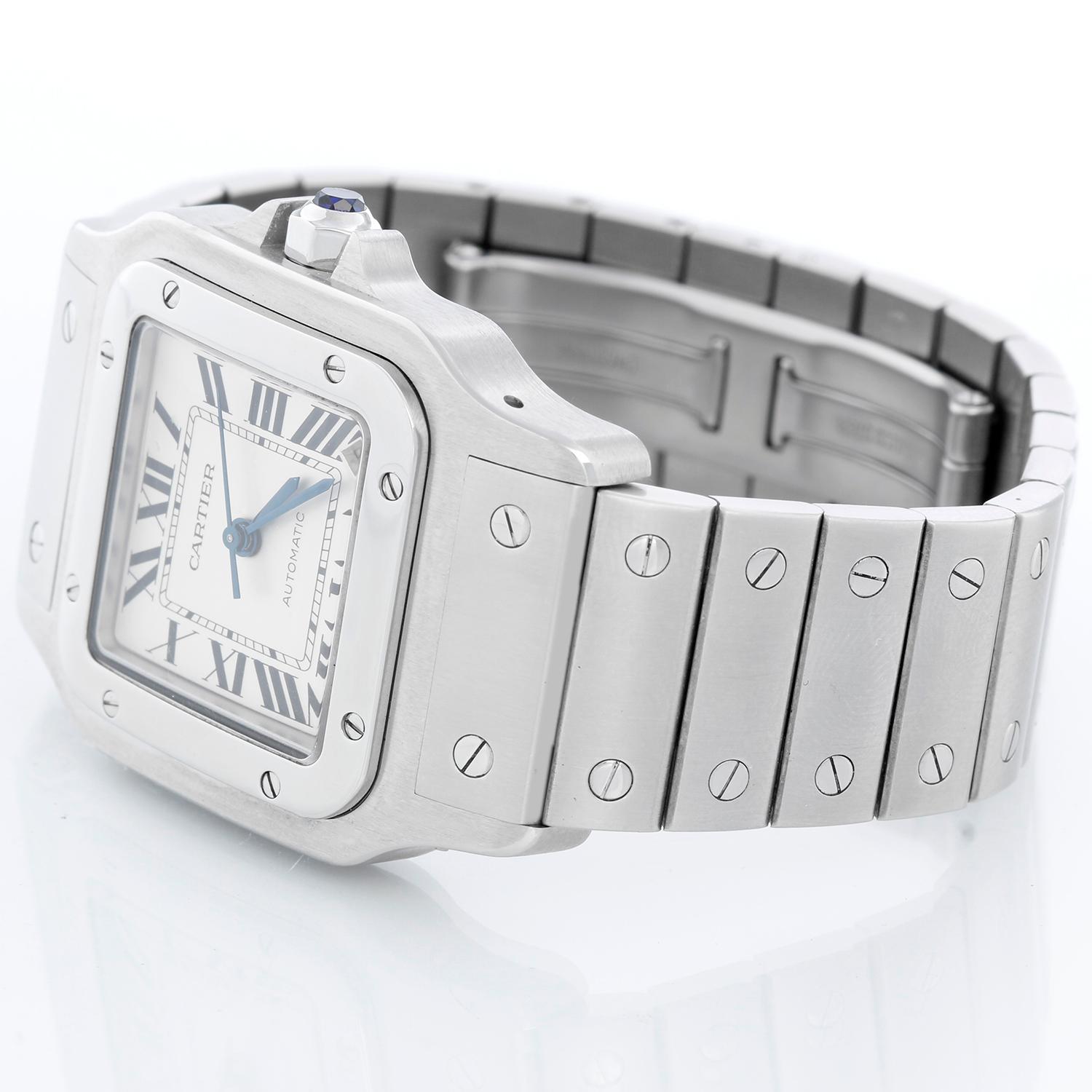Cartier Santos Steel XL Automatic Men's Watch W20098D6 2823 - Automatic winding. Stainless steel case (34mm x 45mm). Silver dial with black Roman numerals and date at 5 o'clock. Stainless steel Cartier deployant style bracelet; fits a 7 inch wrist