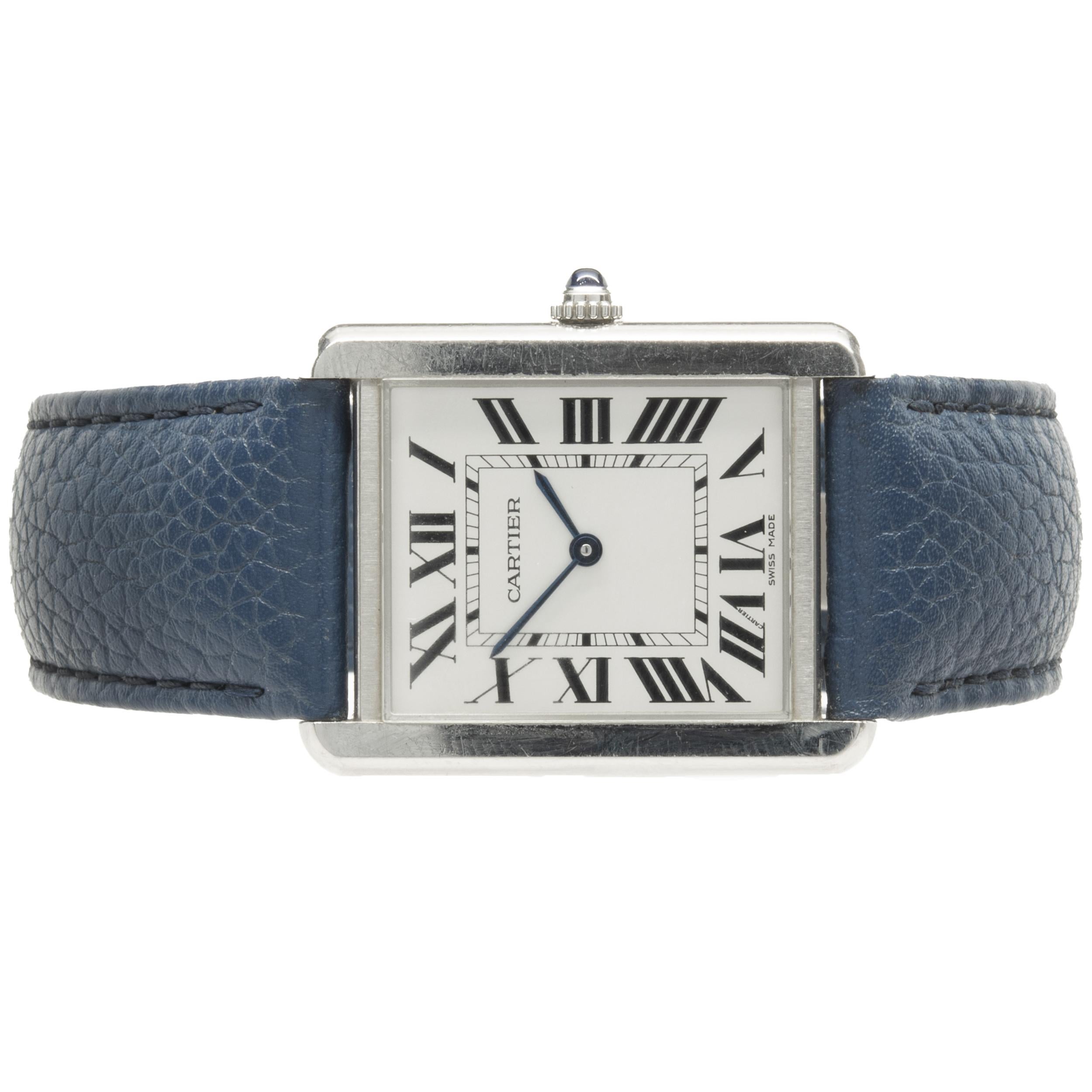 Movement: quartz
Function: hours, minutes
Case: 35 x 27mm stainless steel rectangular case, push pull crown, sapphire crystal
Dial: white roman dial, steel sword sweeping hands
Band: Cartier blue leather strap, fold over clasp
Serial #: