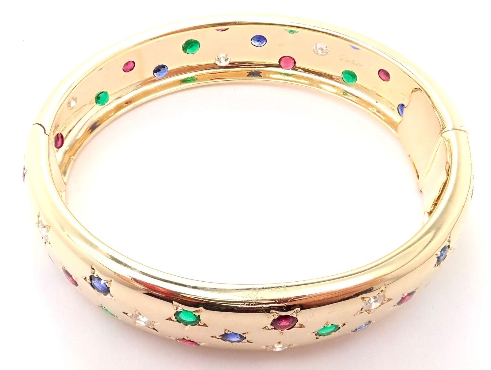 Cartier Bracelet jonc étoilé en or jaune avec diamants, rubis et émeraudes Unisexe en vente