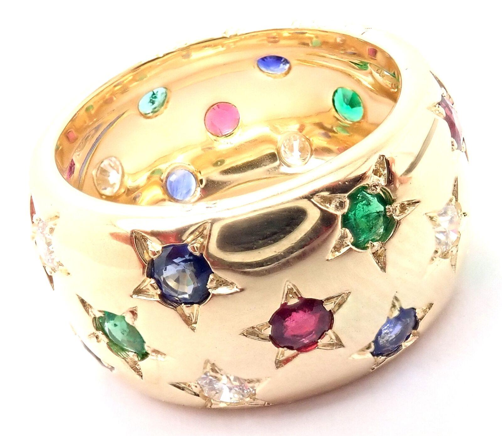 18k Yellow Gold Diamond Sapphire Emerald Ruby Wide Star Band Ring by Cartier.
With Round brilliant cut diamonds VVS1 clarity, F-H color Round rubies, emeralds and sapphires
7 round sapphires
8 round emeralds
6 round rubies
This ring comes with