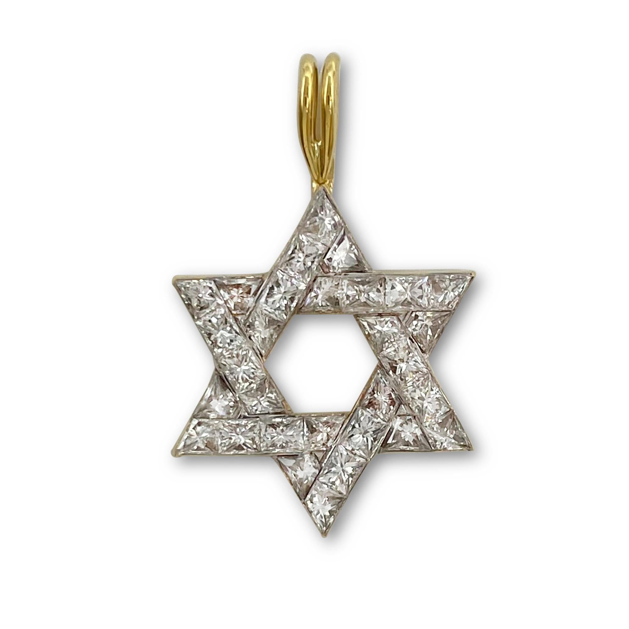Authentic Cartier pendant crafted in 18 karat yellow gold.  The Star of David motif is set with approximately 1.11 carats of glittering princess cut diamonds, D-F color, VS clarity.  The pendant measures 0.68 inches x 0.68.  Signed Cartier with