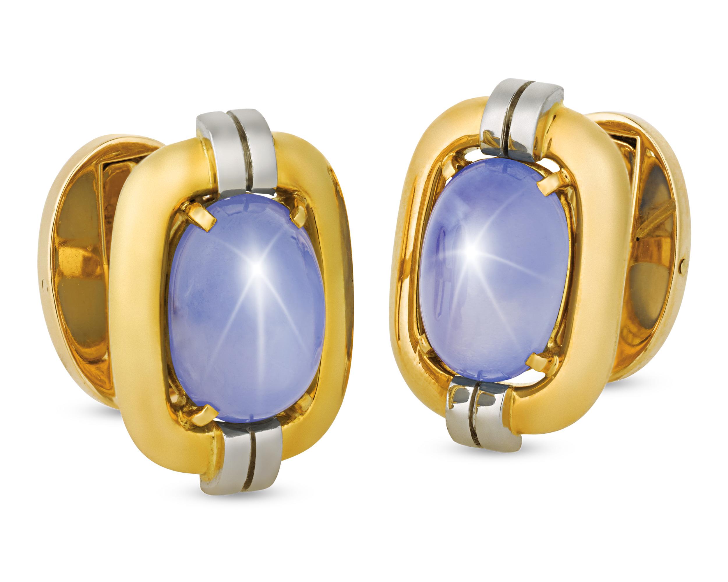 Two star sapphires totaling approximately 30.00 carats display a sophisticated hue and shine in these classic men's cufflinks from Cartier. The star sapphire’s trademark six-pointed star is the result of a phenomenon called asterism. The stone