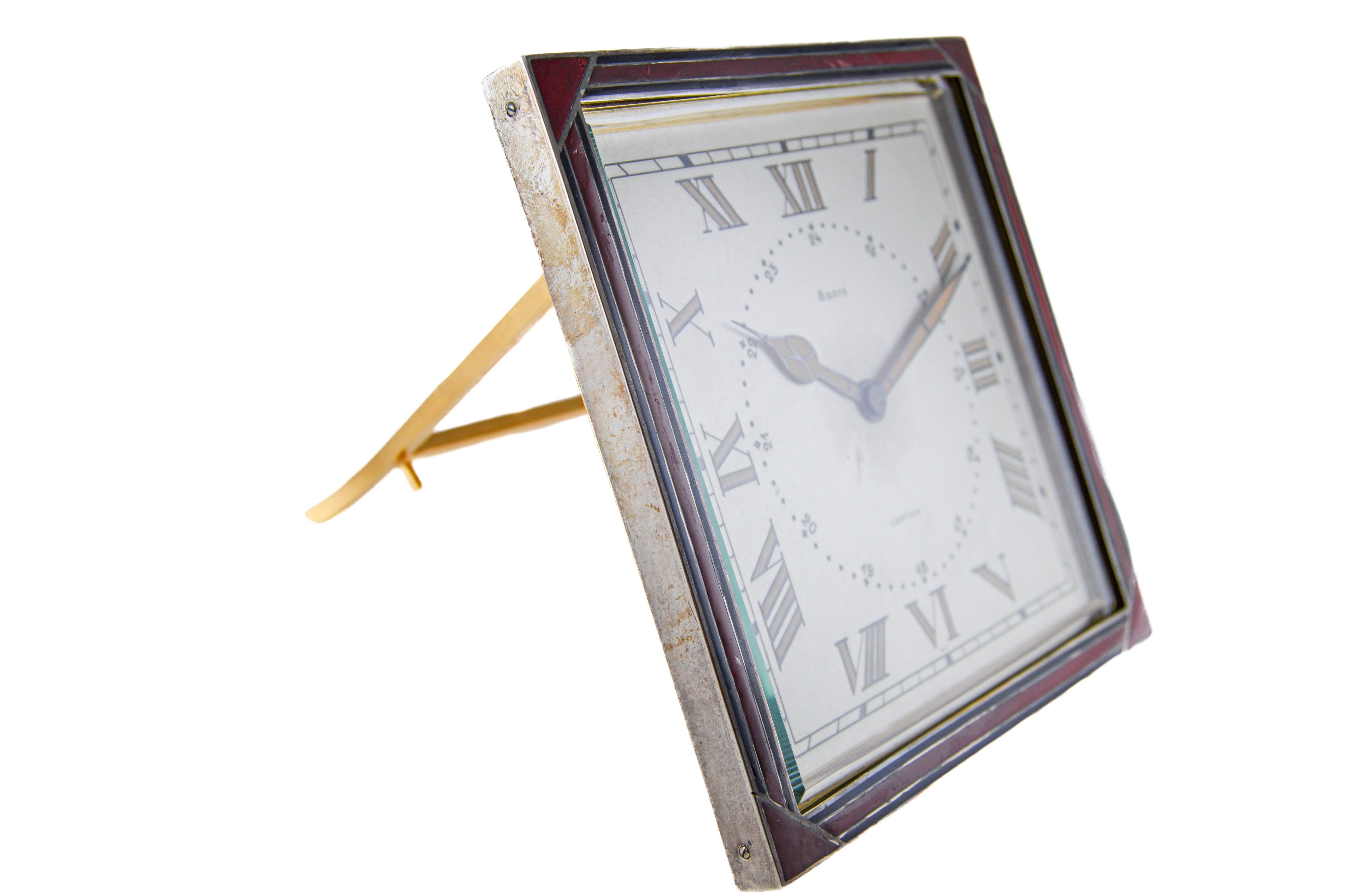 FACTORY / HOUSE: Cartier 
STYLE / REFERENCE: Art Deco / Desk Clock
METAL / MATERIAL: Sterling Silver / Kiln Fired Enamel 
CIRCA / YEAR: 1920's
DIMENSIONS / SIZE: 5 inches Length X 5 inches Width
MOVEMENT / CALIBER: Manual Winding / 15 Jewels 
DIAL /