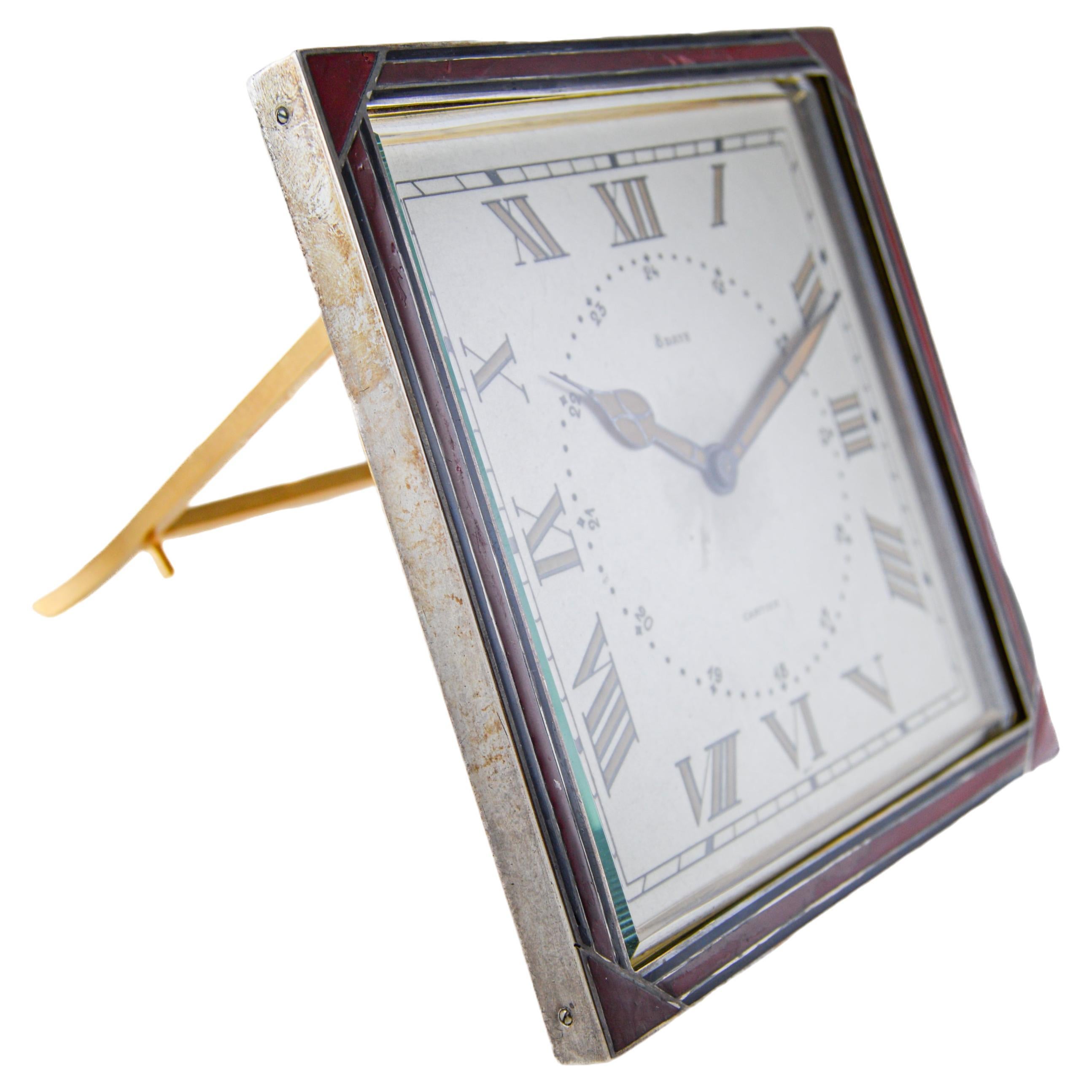 FACTORY / HOUSE: Cartier 
STYLE / REFERENCE: Art Deco / Desk Clock
METAL / MATERIAL: Sterling Silver / Kiln Fired Enamel 
CIRCA / YEAR: 1920's
DIMENSIONS / SIZE: 5 inches Length X 5 inches 
MOVEMENT / CALIBER: Manual Winding / 15 Jewels 
DIAL /