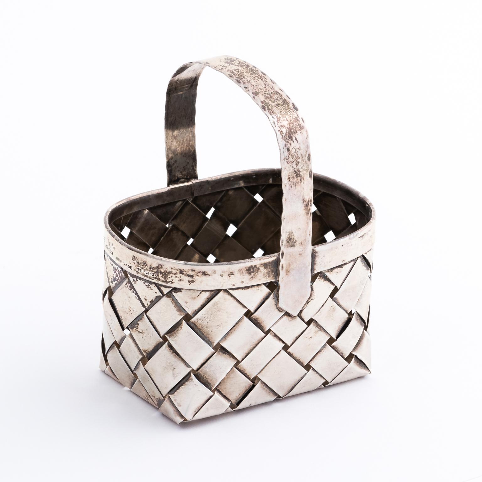 Sterling silver basket by Cartier, circa 1950. It weighs 113.3 grams. Handwoven and fully marked.
  