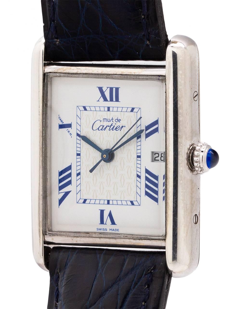 
Cartier Man’s Tank Louis, ref 2414 circa 2000s larger size sterling silver 25 x 35mm water resistant style case secured by 8 case back screws and blue cabochon sapphire crown. Off white dial signed must de Cartier, with even number Roman numerals