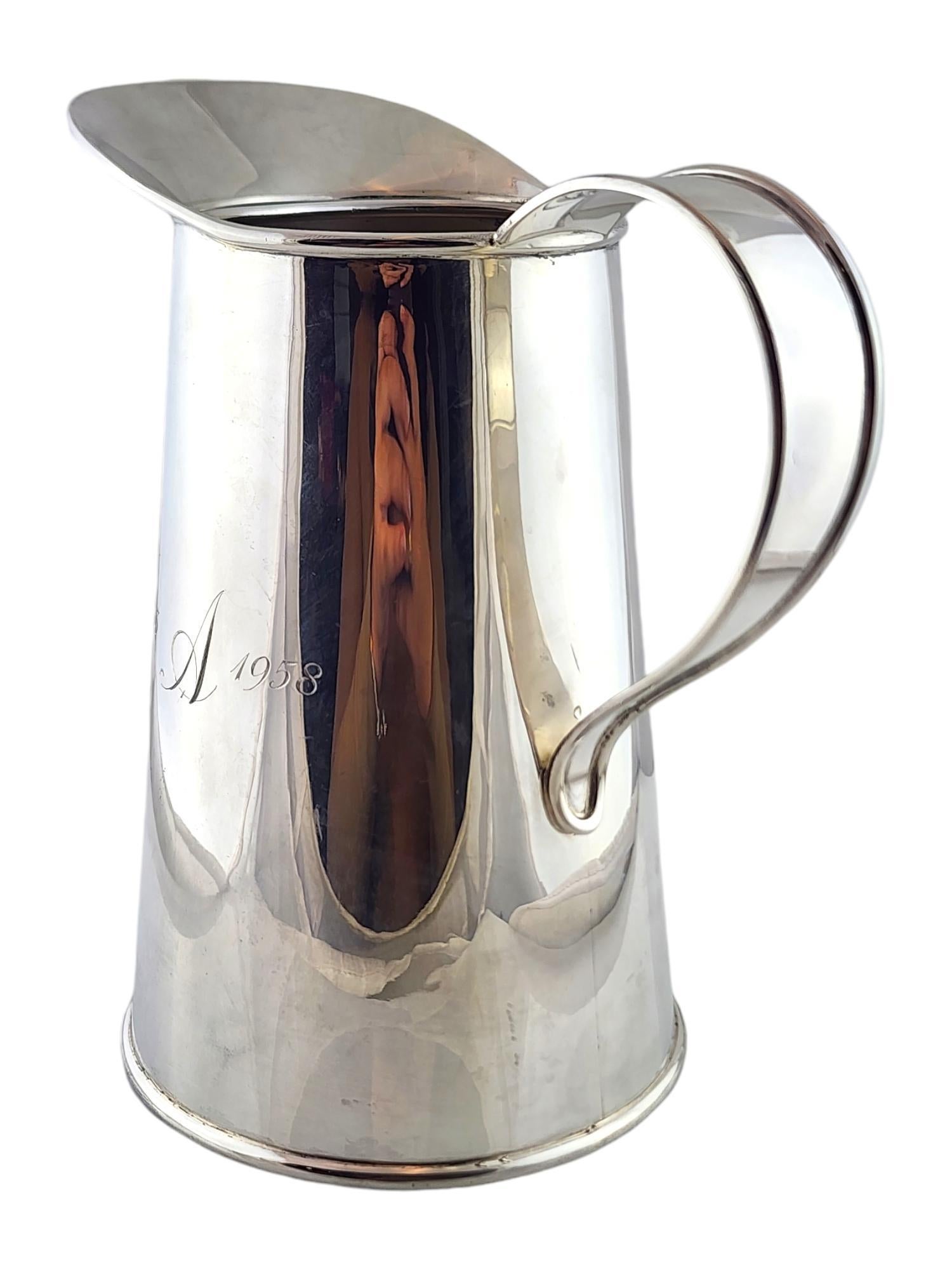 Cartier Sterling silver Water Pitcher 

This beautiful water pitcher was meticulously crafted from sterling silver by Cartier and is engraved with 