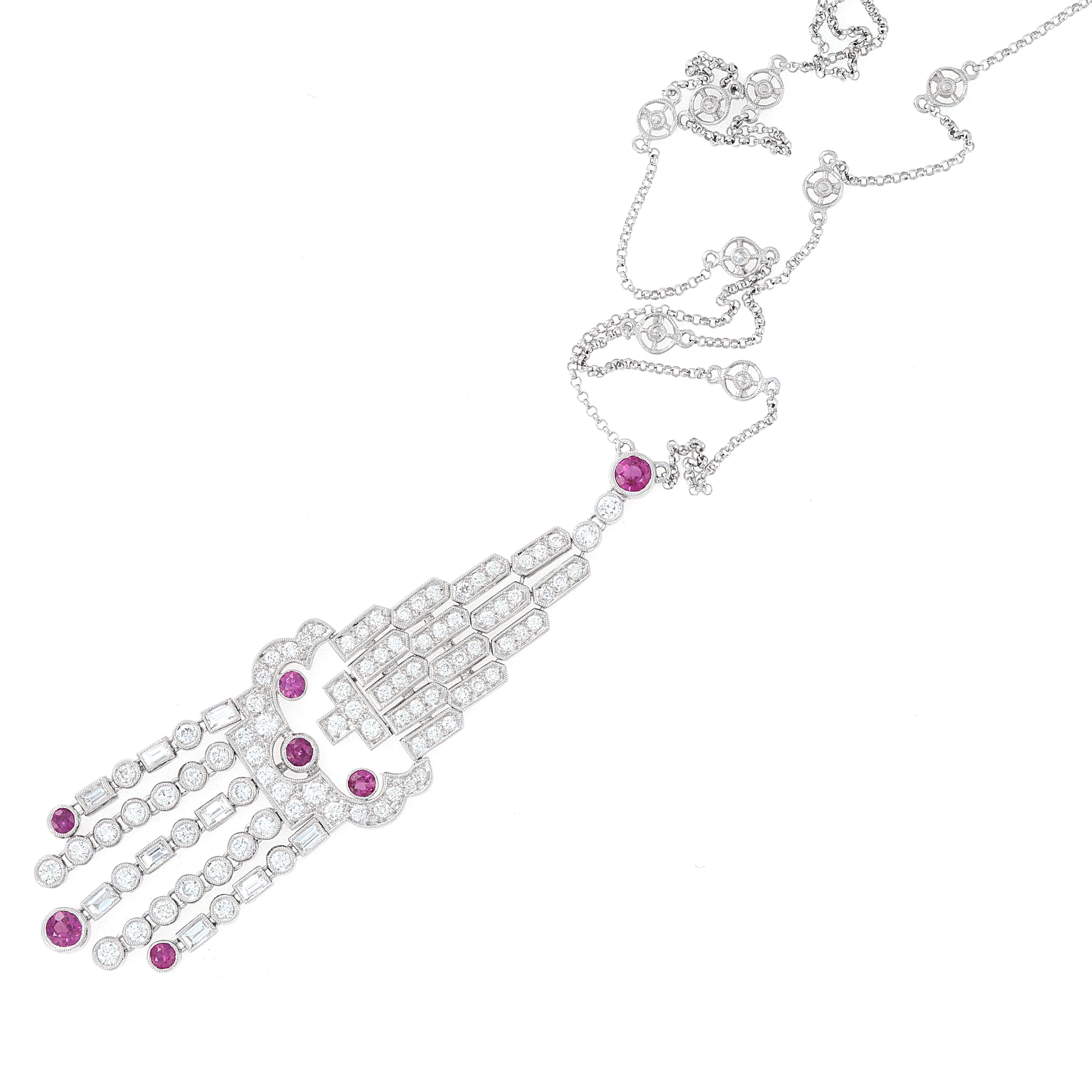 This 18k white gold ruby and diamond necklace has great movement to it. As it sits below the neck, the tassels on the bottom will swing with each step. Diamonds are high quality, white in color and very few inclusions. 

D = 2.20 ctw.
R = 1.25 ctw.