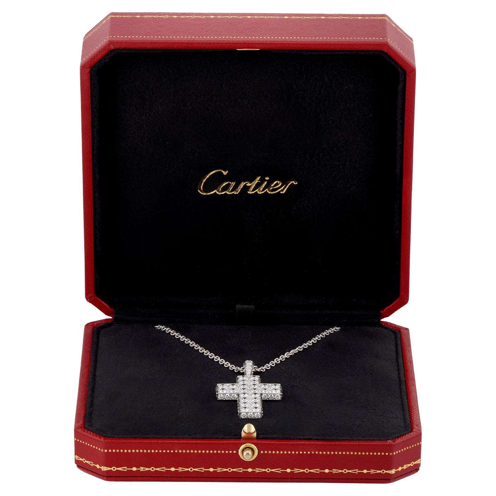 This stunning Cartier pendant is designed as a Latin cross crafted in 18k white gold and set with approximately 70 D-E-F VVS1-VVS2  brilliant-cut round diamonds weighing an estimated 6.50 carats. The pendant features a diamond pave on the front and