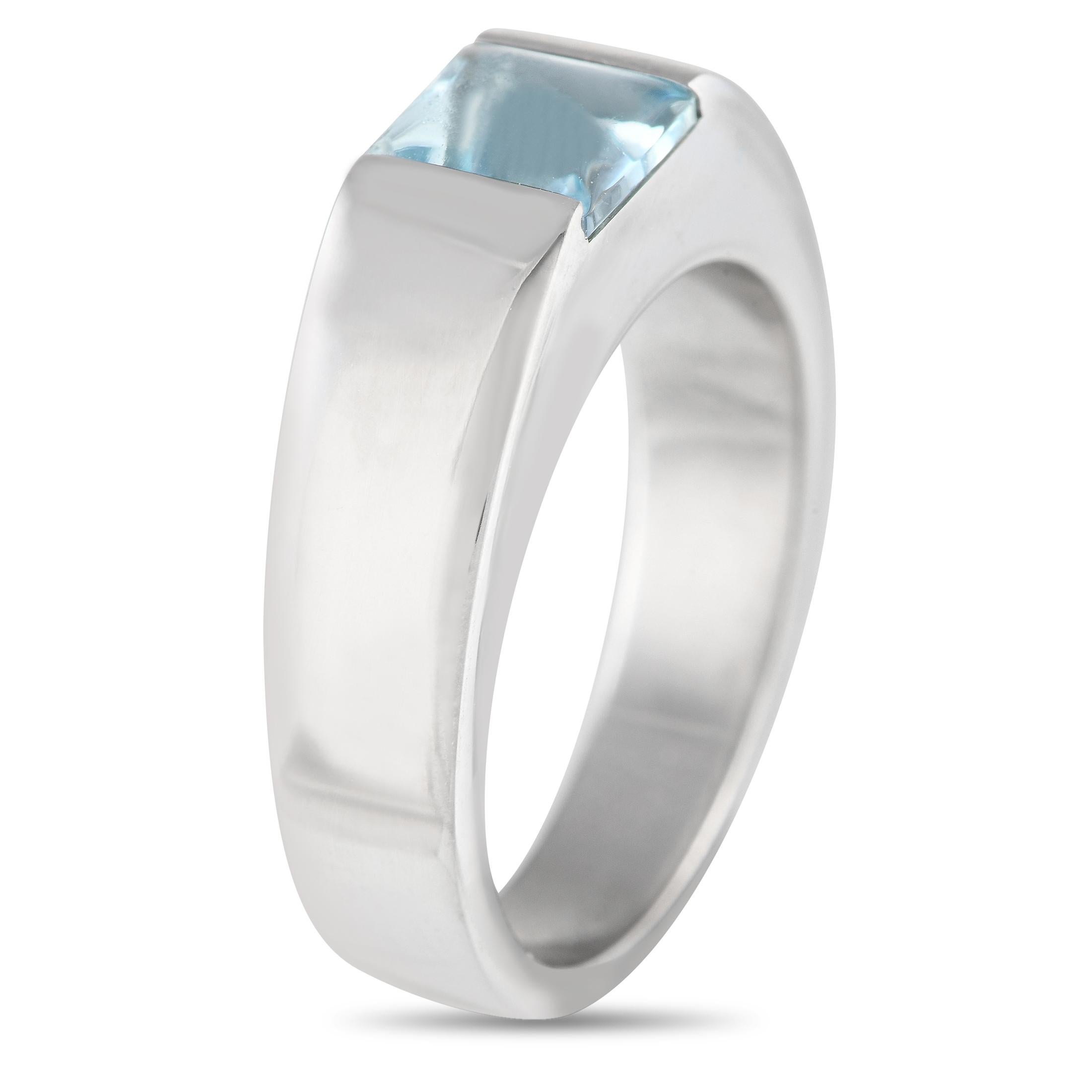 A modern 18K White Gold setting provides the perfect foundation on this exquisite Cartier Tank ring. Simple, elegant, and understated, this piece features a stunning Aquamarine gemstone accenting the center of the design. This luxury ring features a