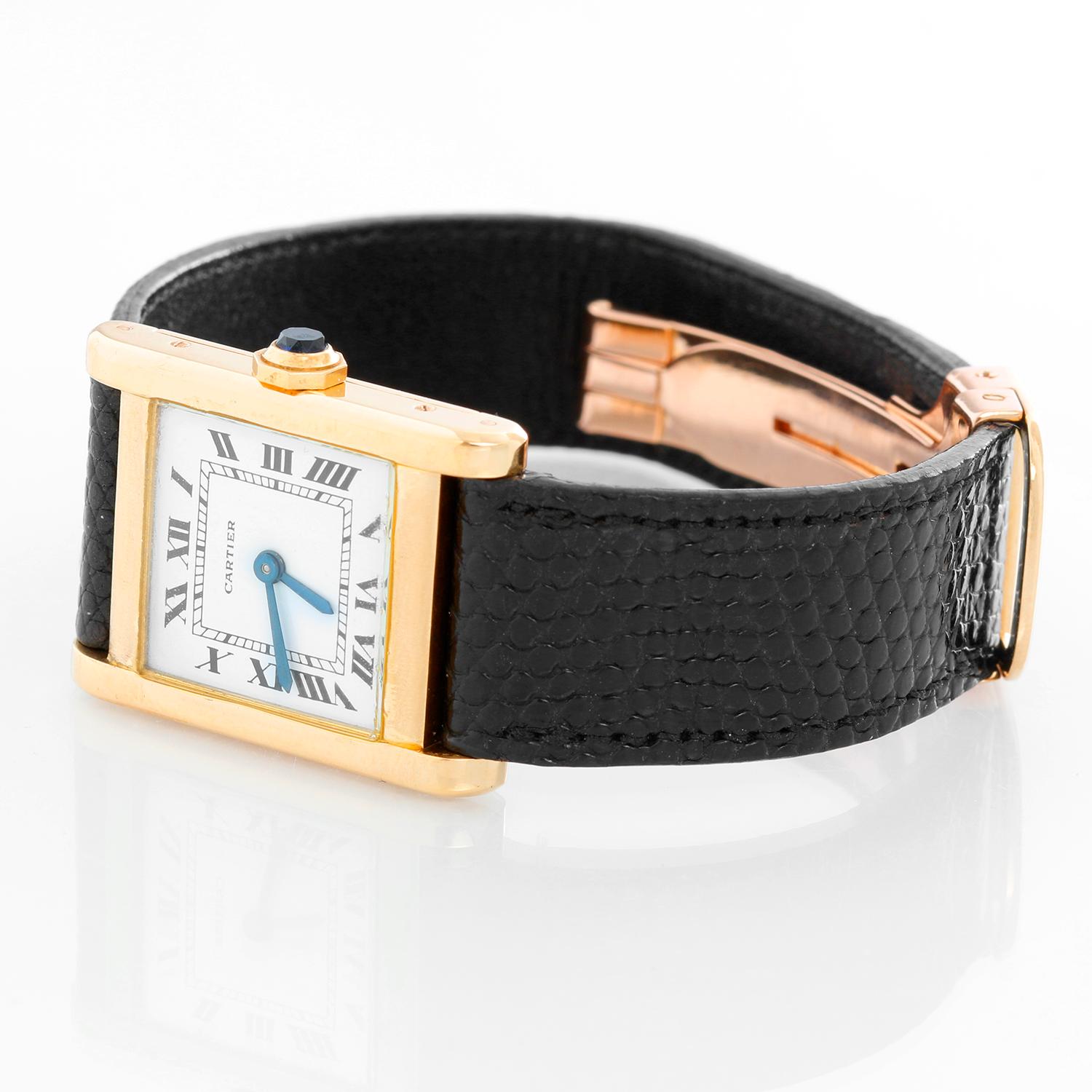Cartier Tank 18K Yellow Gold Men's Watch  - Manual winding . 18K yellow gold ( 22 x 30 mm) . White dial with Roman numerals . Black alligator strap with Cartier deployant buckle . Pre-owned with custom box .