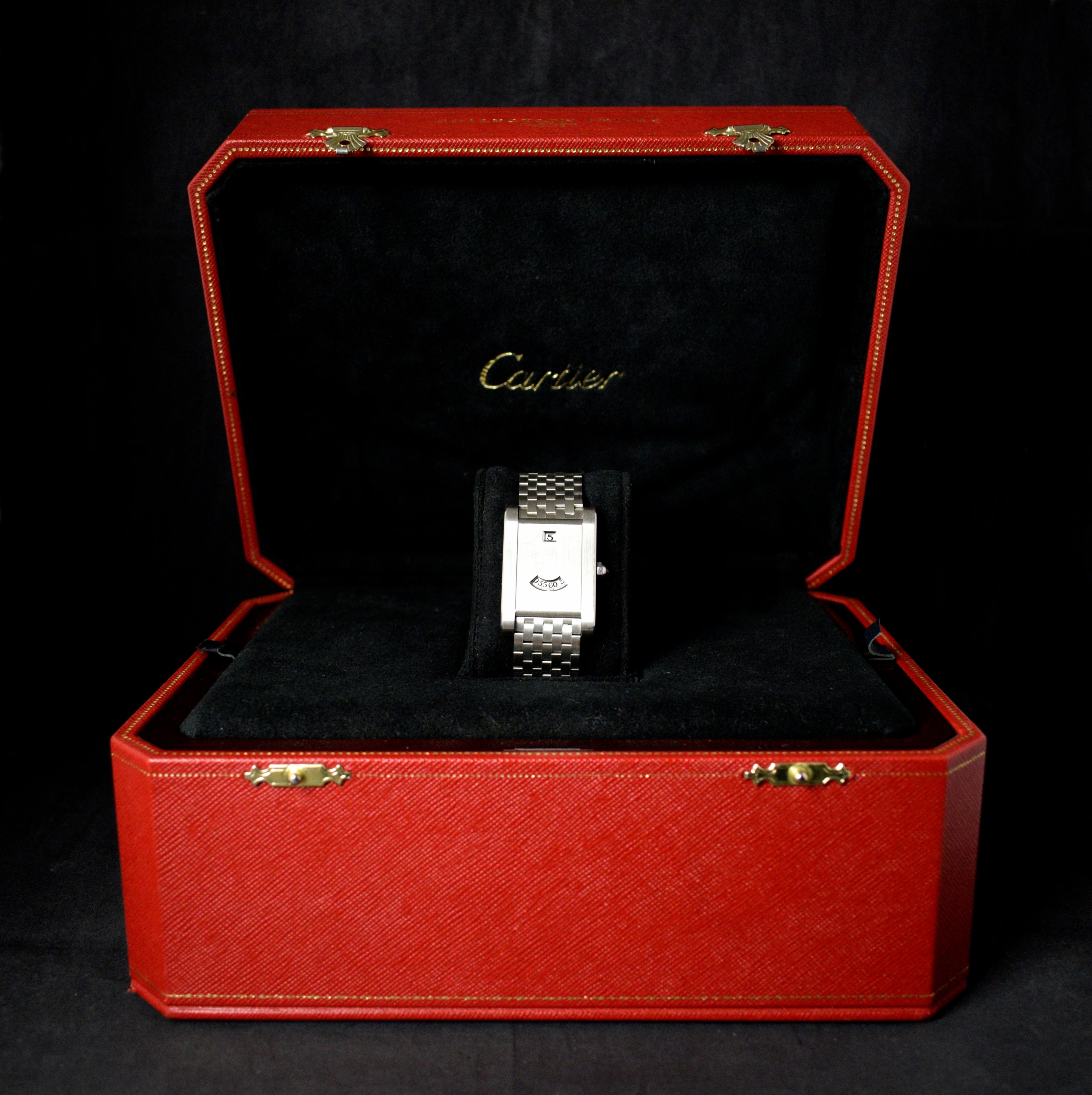Brand: Cartier
Model: Tank à Guichets CPCP Jump Hour
Year: 1997
Limited Edition: 0xx / 150
Reference: OT1676

Created by Louis Cartier in 1917 and inspired by the very first Renault tanks deployed in 1917 during World War I. Legend has it that the