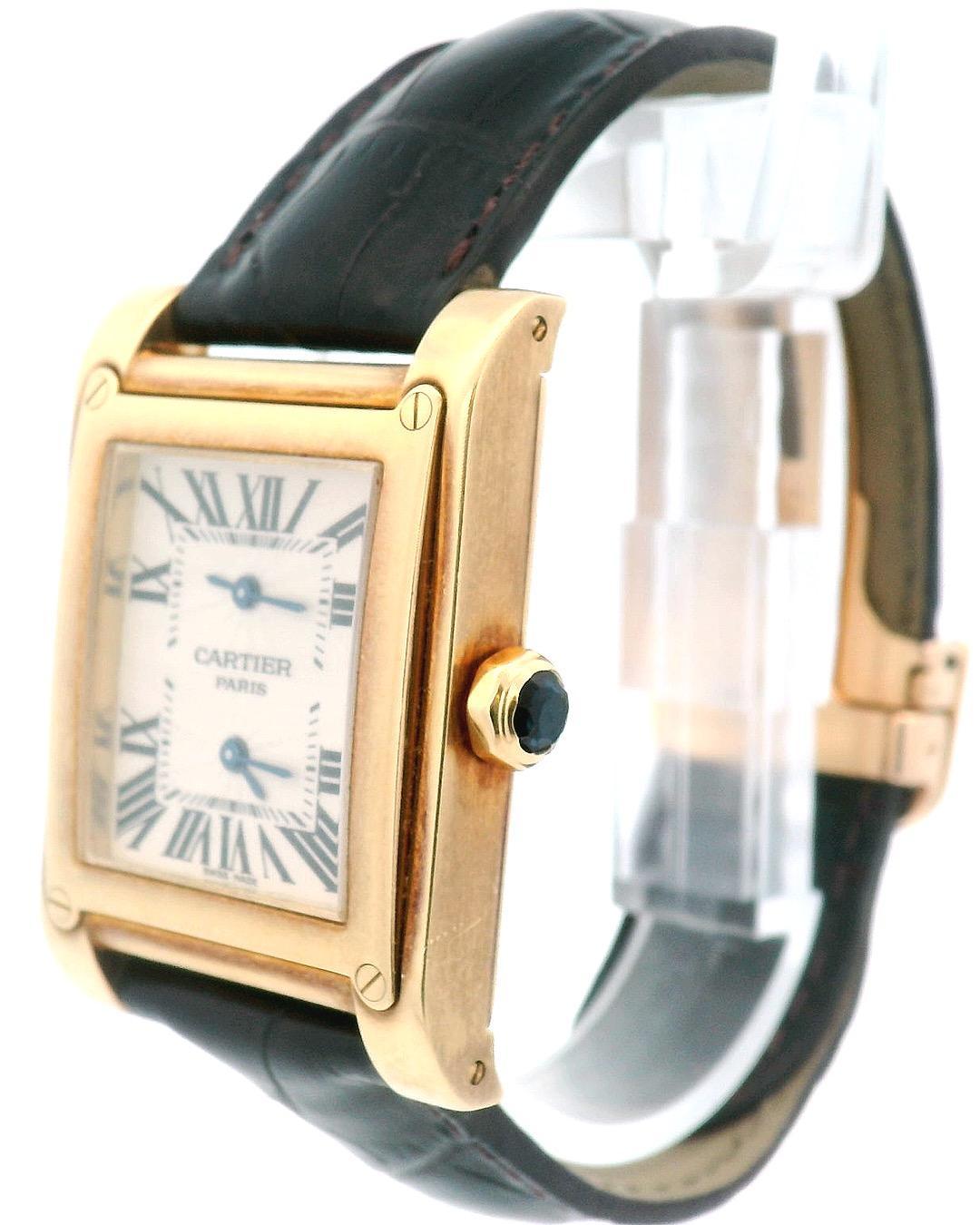 Cartier Tank a Vis W1534251 watch. 28mm 18K yellow gold case size with 18K yellow gold bezel. Guilloche Silver dial with black Roman numeral hour marker. Minute marks on inner dial. The dial display double mechanism with signature blue sword-like