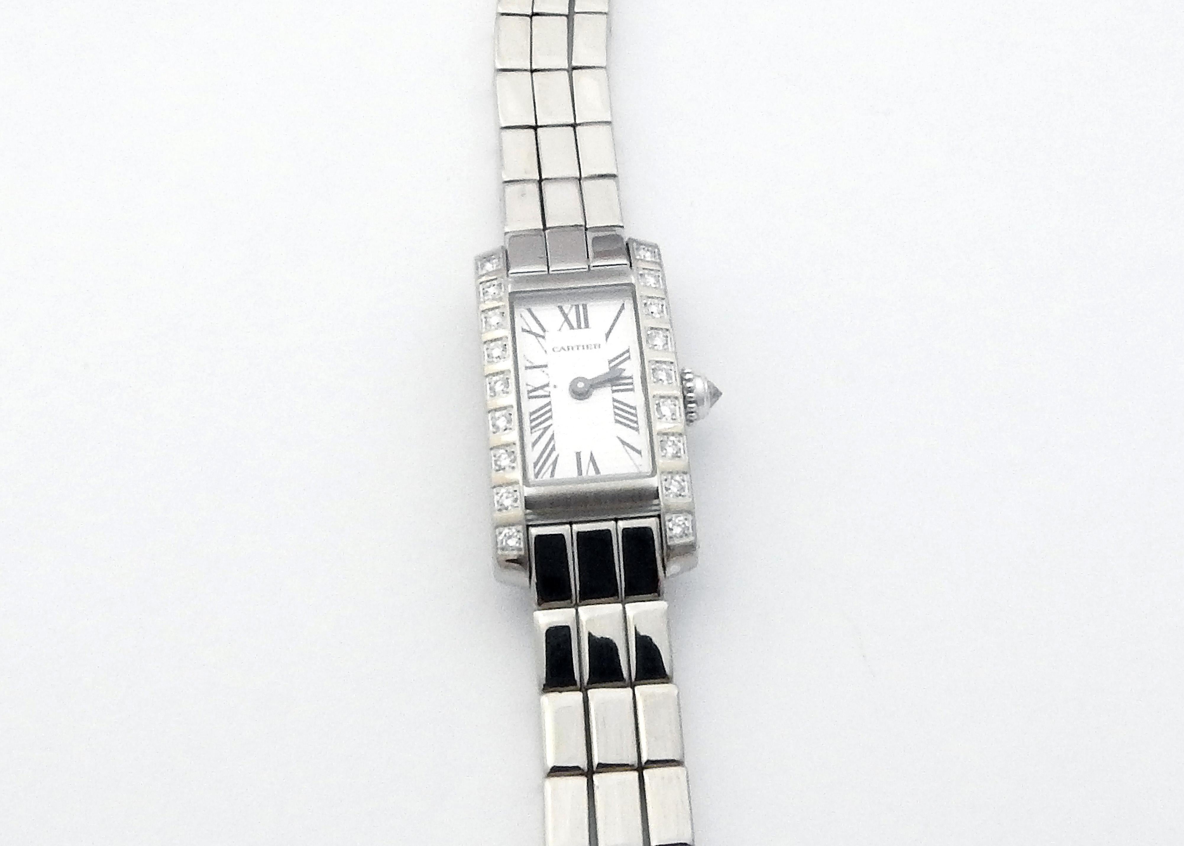 Cartier Tank Allongee Lanieres 18K White Gold and Diamond Ladies Watch

Model: W15364W3 / 2544
Serial: 13930CE

This authentic Cartier Tank watch is set in 18K white gold

Bezel is set with 18 round brilliant diamonds. 

Crown is set with one round