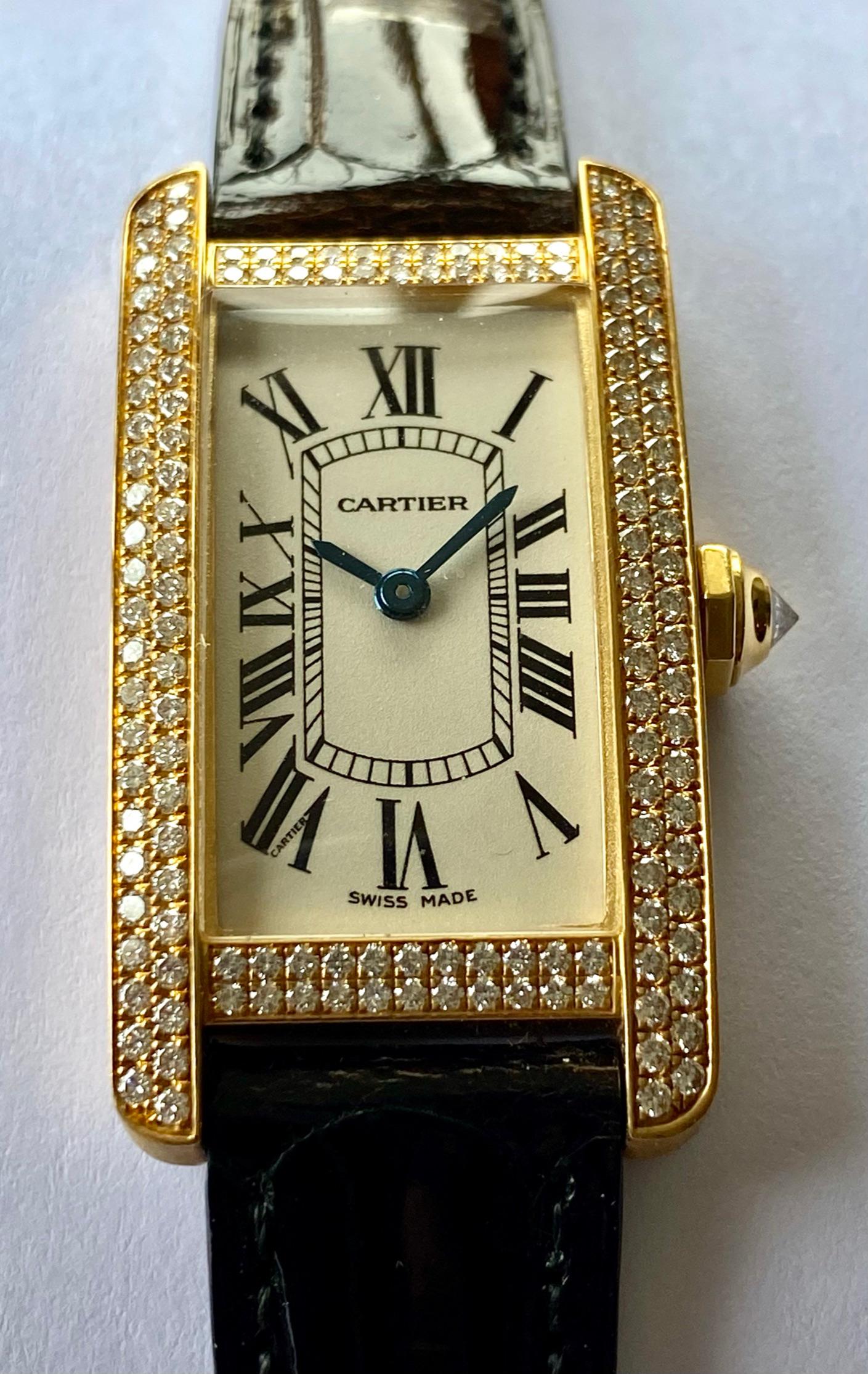 One (1) Yellow Gold Lady's Watch, leather strap and 18K. yellow Gold folding Buccle.
Brand: Cartier Model: Tank Americain, with original Cartier Diamonds 
Model nr: WB705631   New watch N.O.S.  
Original Box and papers
Cartier Garantee on this watch