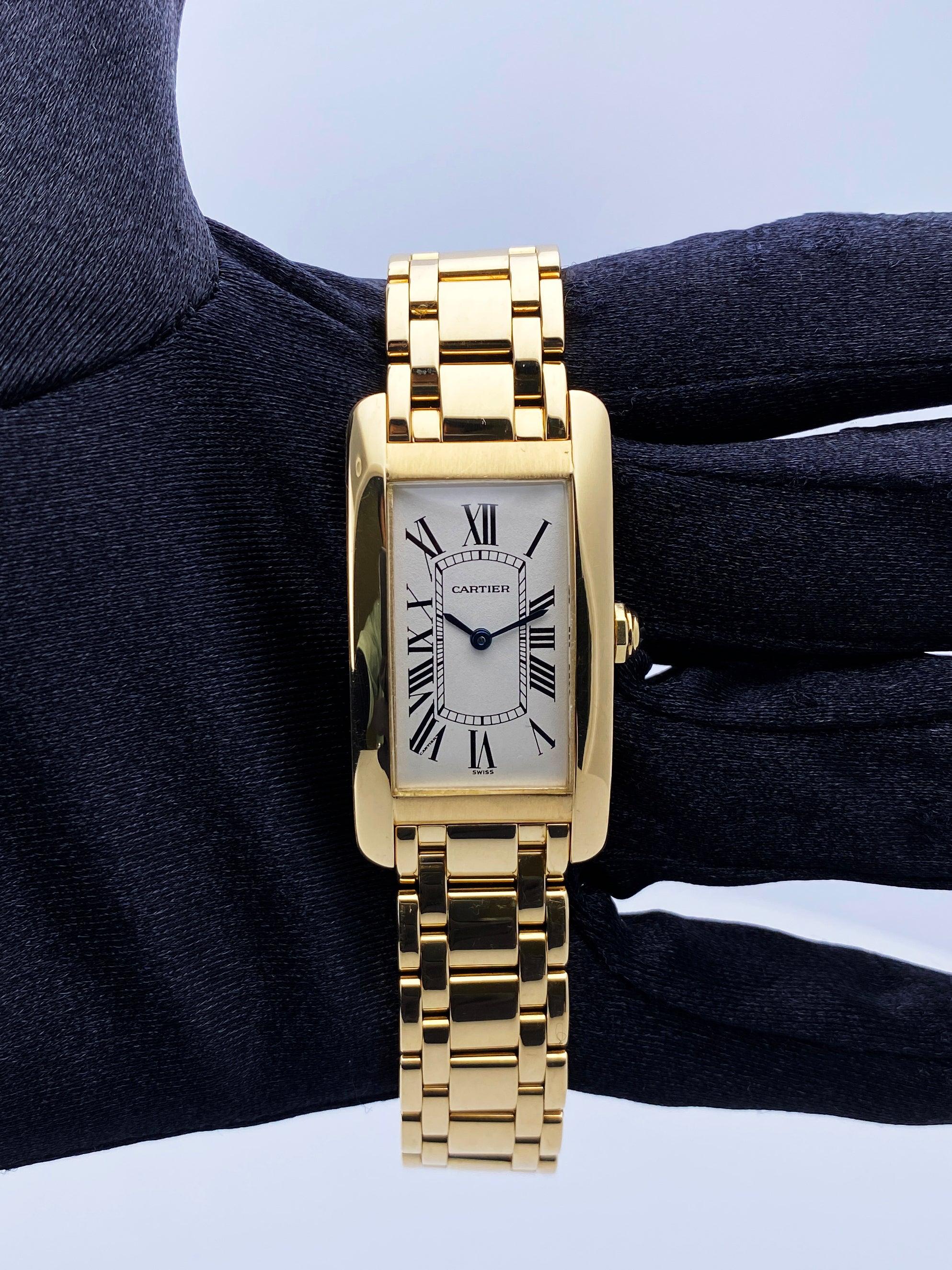 Cartier Tank Americaine 1721 Watch. 23mm 18K yellow gold case. 18K yellow gold stationary bezel. Off-White dial with blue steel hands and Roman numeral hour markers. Minute markers on the inner dial. 18K yellow gold bracelet with hidden