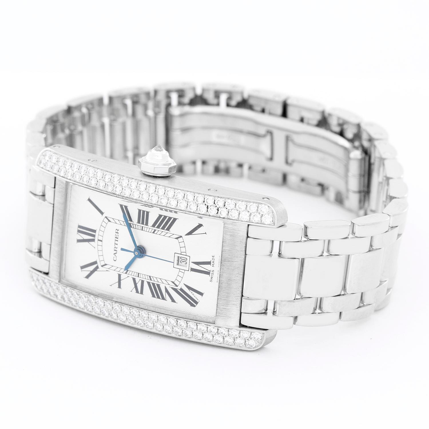 Cartier Tank Americaine 18k White Gold  Men's or Ladies Midsize Watch WB7026L1 - Automatic  winding. 18k white gold case (23mm x 41mm) Double Diamond Row. Guilloche dial with black Roman numerals; date at 6 o'clock position. 18K White gold cartier