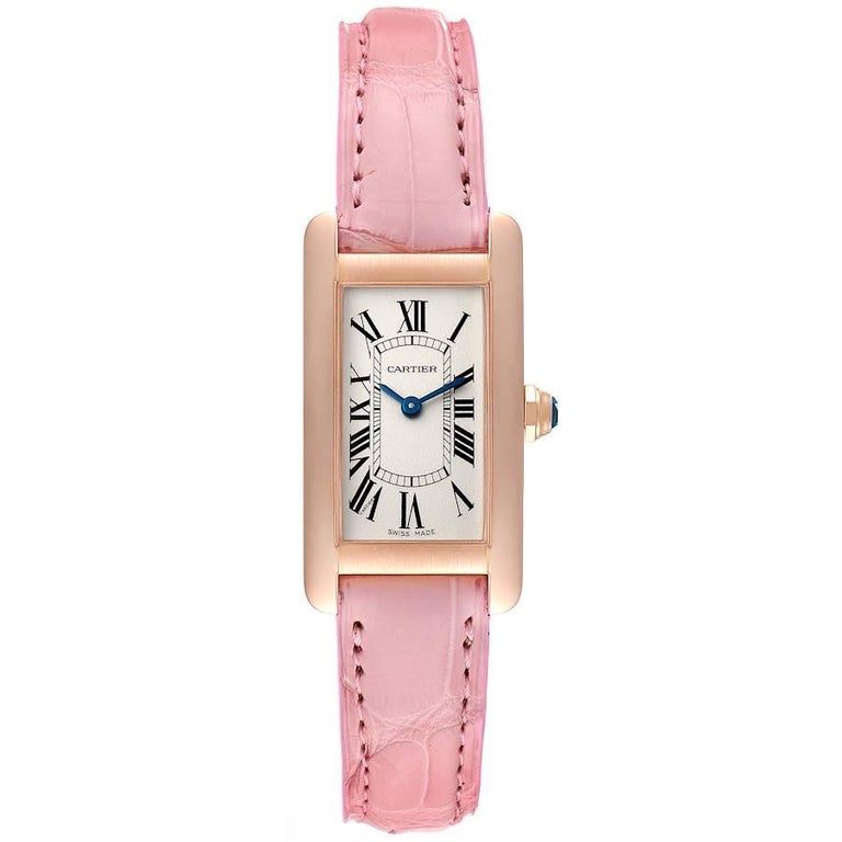 Cartier Tank Americaine 18K Rose Gold Silver Dial Ladies Watch W2607456. Quartz movement. 18K rose gold case 19.0 x 35.0 mm. Circular grained crown set with blue faceted sapphire. . Scratch resistant sapphire crystal. Silvered grained dial with