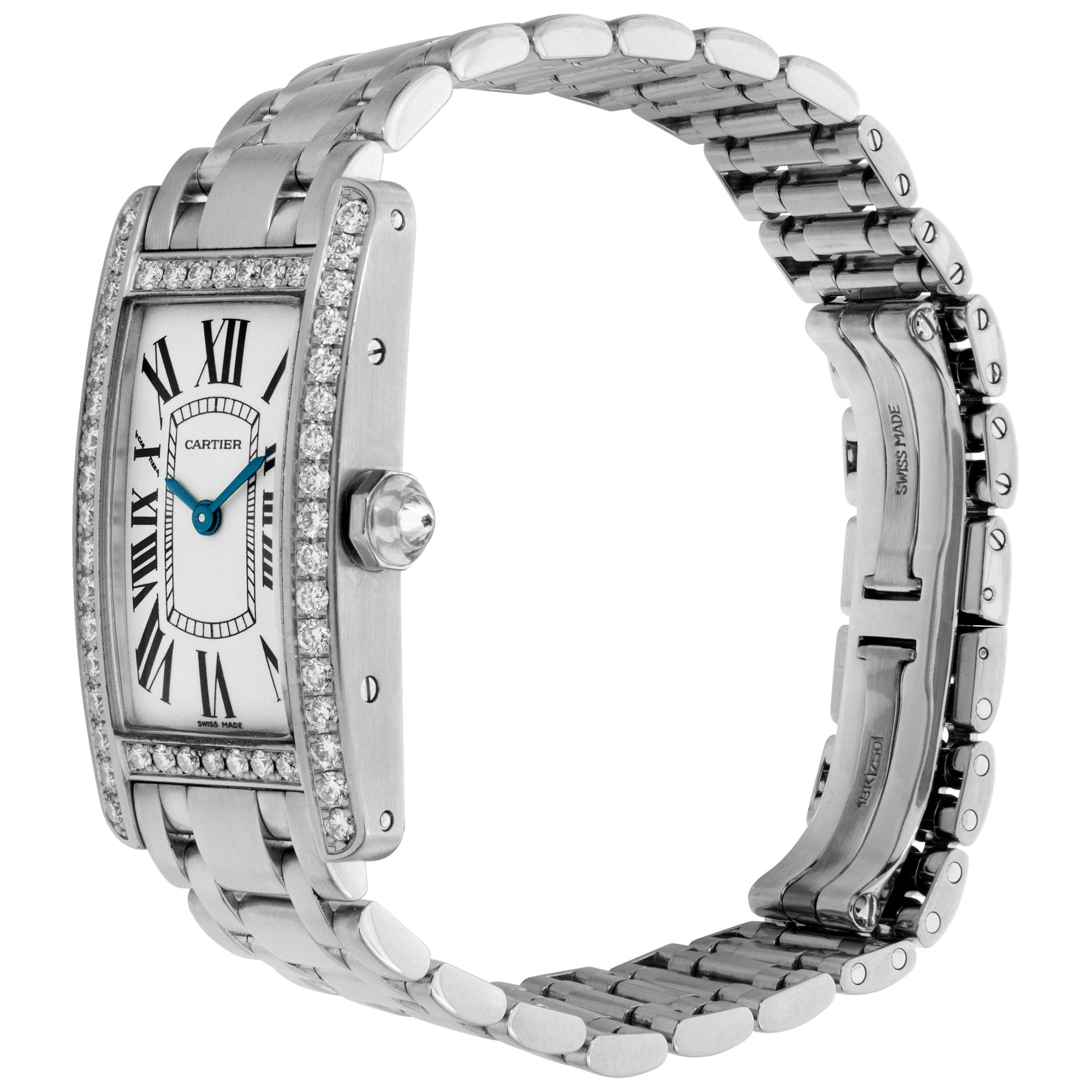 Cartier Tank Americaine in 18k white gold with original diamond bezel and crown on 18k white gold bracelet. Quartz. Measures 35mm long (lug to lug) by 19mm wide. Ref WB7073L1. Circa 2000s. Fine Pre-owned Cartier Watch.

 Certified preowned Dress