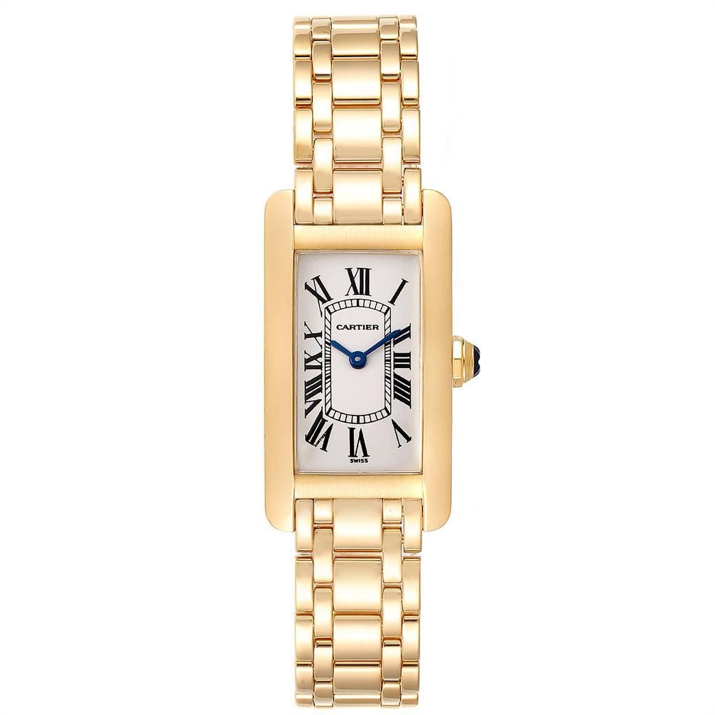 Cartier Tank Americaine 18K Yellow Gold Ladies Watch W26015K2. Quartz movement. 18K yellow gold case 19.0 x 35.0 mm. Circular grained crown set with faceted blue spinel cabochon. Scratch resistant sapphire crystal. Silvered grained dial with black