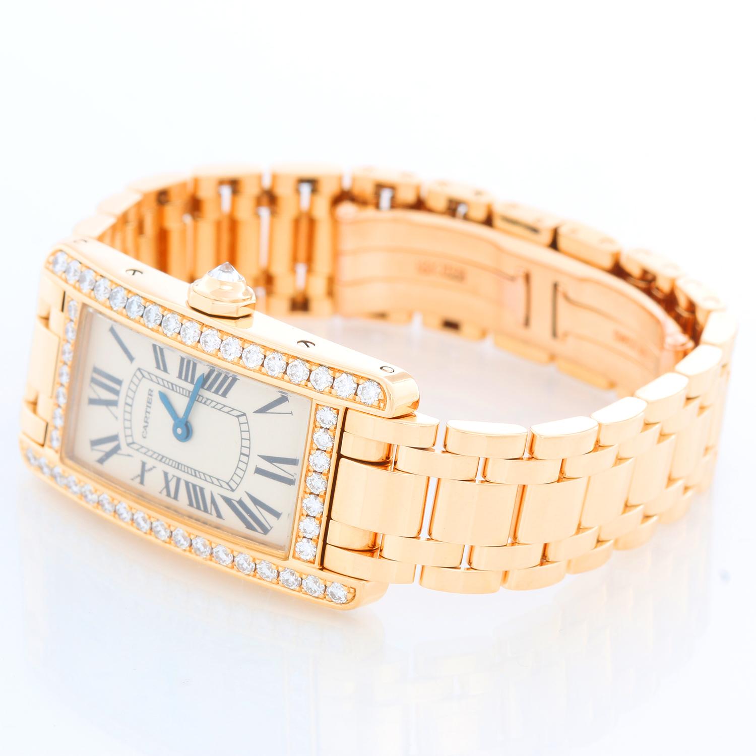 Cartier Tank Americaine Ladies 18k Yellow Gold & Diamond Watch WB7072K2 - Quartz movement. 18k yellow gold case with factory diamond bezel (19mm x 35mm). Ivory colored with black Roman numerals. 18k yellow gold Cartier bracelet with deployant clasp.