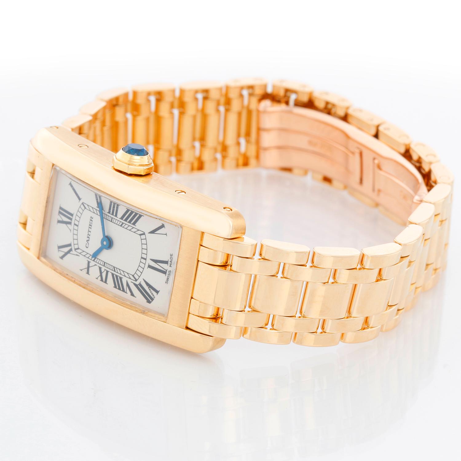Cartier Tank Americaine Ladies 18k Yellow Gold Watch 2482 - Quartz. 18k yellow gold case (19mm x 35mm). Ivory colored dial with black Roman numerals. 18K yellow gold Cartier bracelet; will fit a 6 inch wrist . Pre-owned with Cartier box.