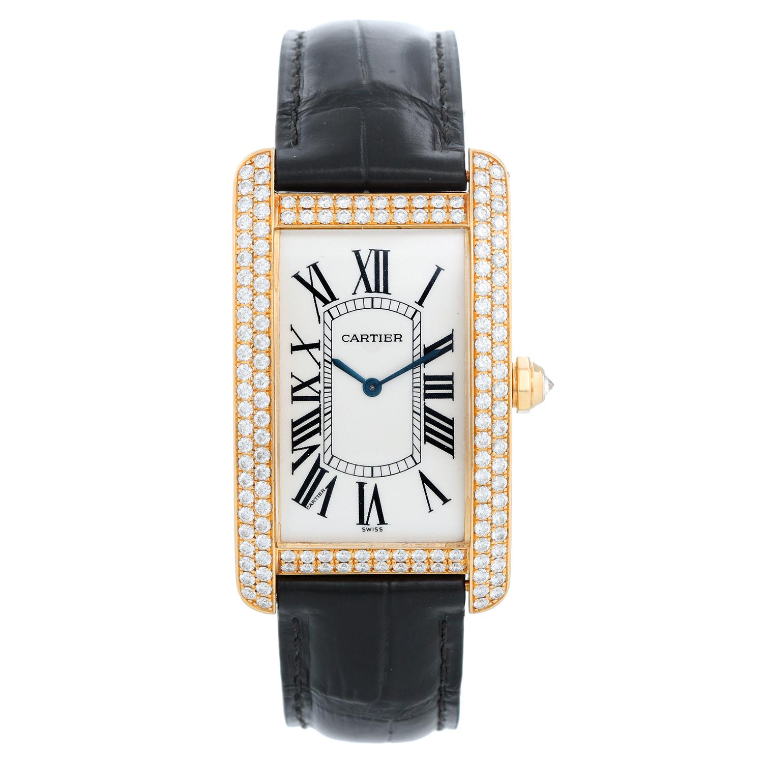 Cartier Tank Americaine Large 18k Yellow Gold & Diamond Watch Ref 1735 - Manual. 18k yellow gold case with 2-row factory diamond bezel (26mm x 45mm). Silver guilloche with black Roman numerals. Black  Cartier leather strap with Cartier tang buckle.