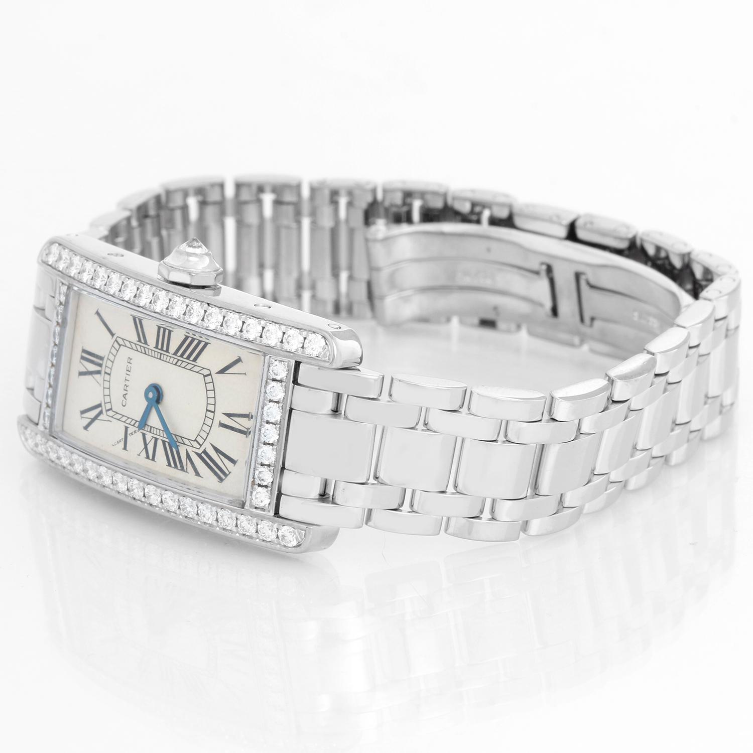 Cartier Tank Americaine (or American) Ladies WG Diamond Watch  2489 - Quartz movement. 18k white gold case with factory diamond bezel  (19 mm x 35 mm ). Silver colored Dial with black Roman numerals. 18k white gold Cartier bracelet with deployant