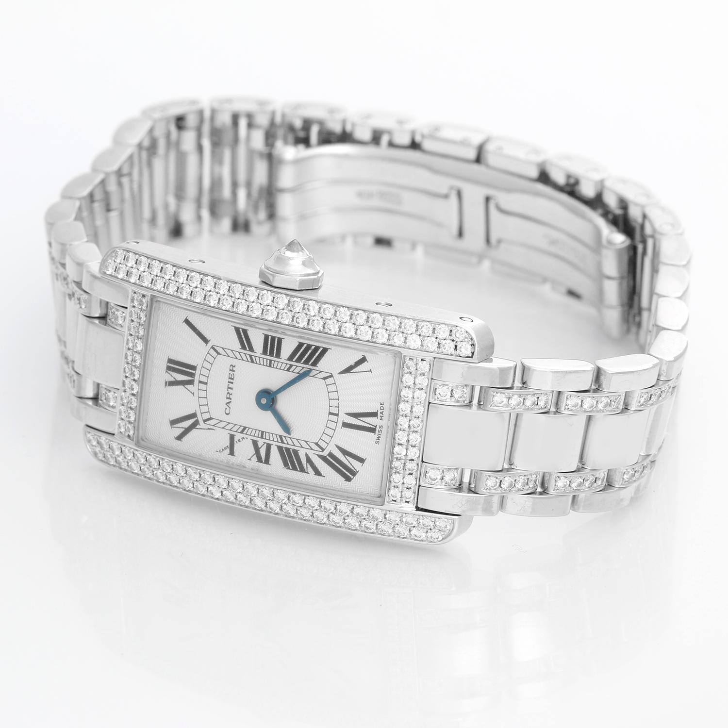 Cartier Tank Americaine (or American) Ladies White Gold Diamond Watch WB7018L1 - Quartz movement. 18k white gold case with 2-row factory diamond bezel  (19 mm x 35 mm ). Silver colored with black Roman numerals. 18k white gold Cartier bracelet with
