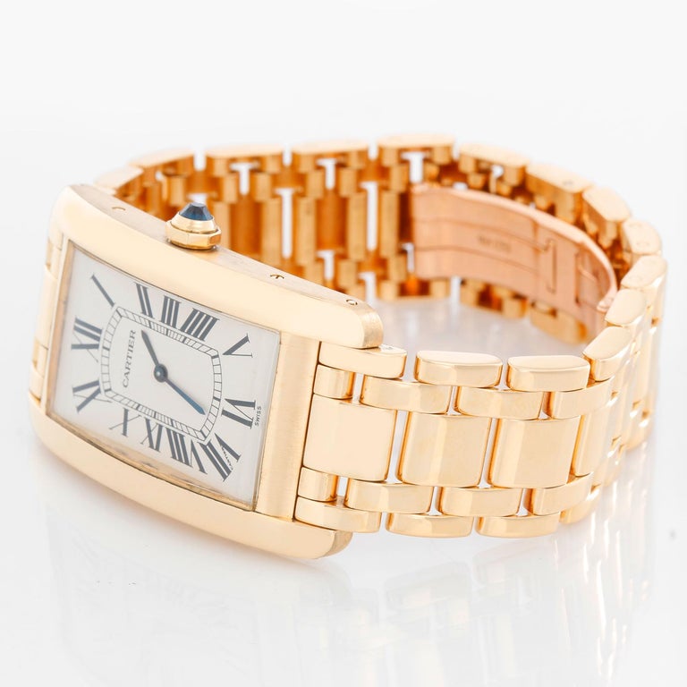Cartier Tank Americaine (or American) Large  Men's Gold Watch 1735 - Manual winding. 18k yellow gold rectangular style case (26 mm x 45mm). Ivory dial with Roman numerals. 18K Yellow gold Cartier bracelet. Pre-owned with Cartier box. 