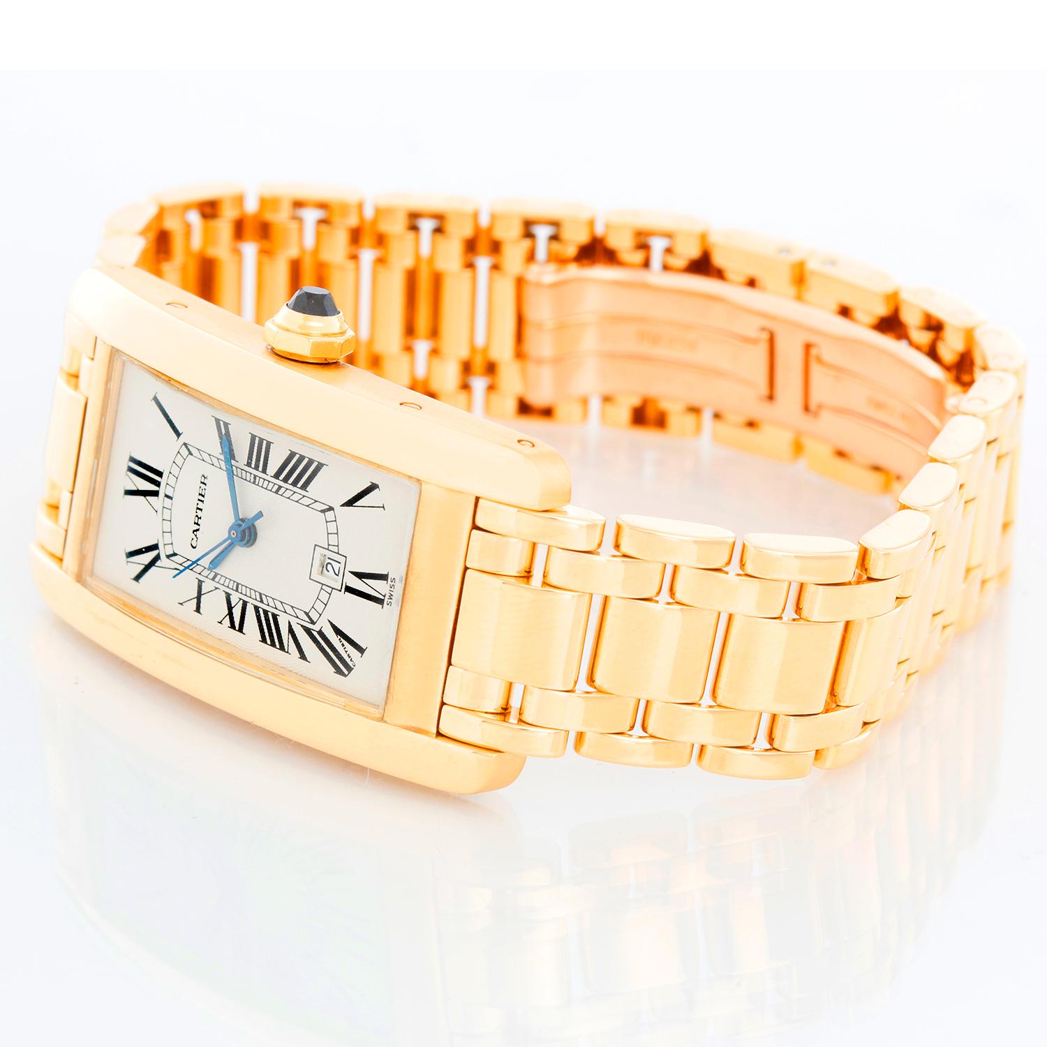 Cartier Tank Americaine (or American) Men's Gold Watch W2603156 - Automatic winding with date. 18k yellow gold rectangular style case (23 mm x 42 mm). Silver dial with black Roman numerals. 18K yellow gold Cartier bracelet. Pre-owned with Cartier