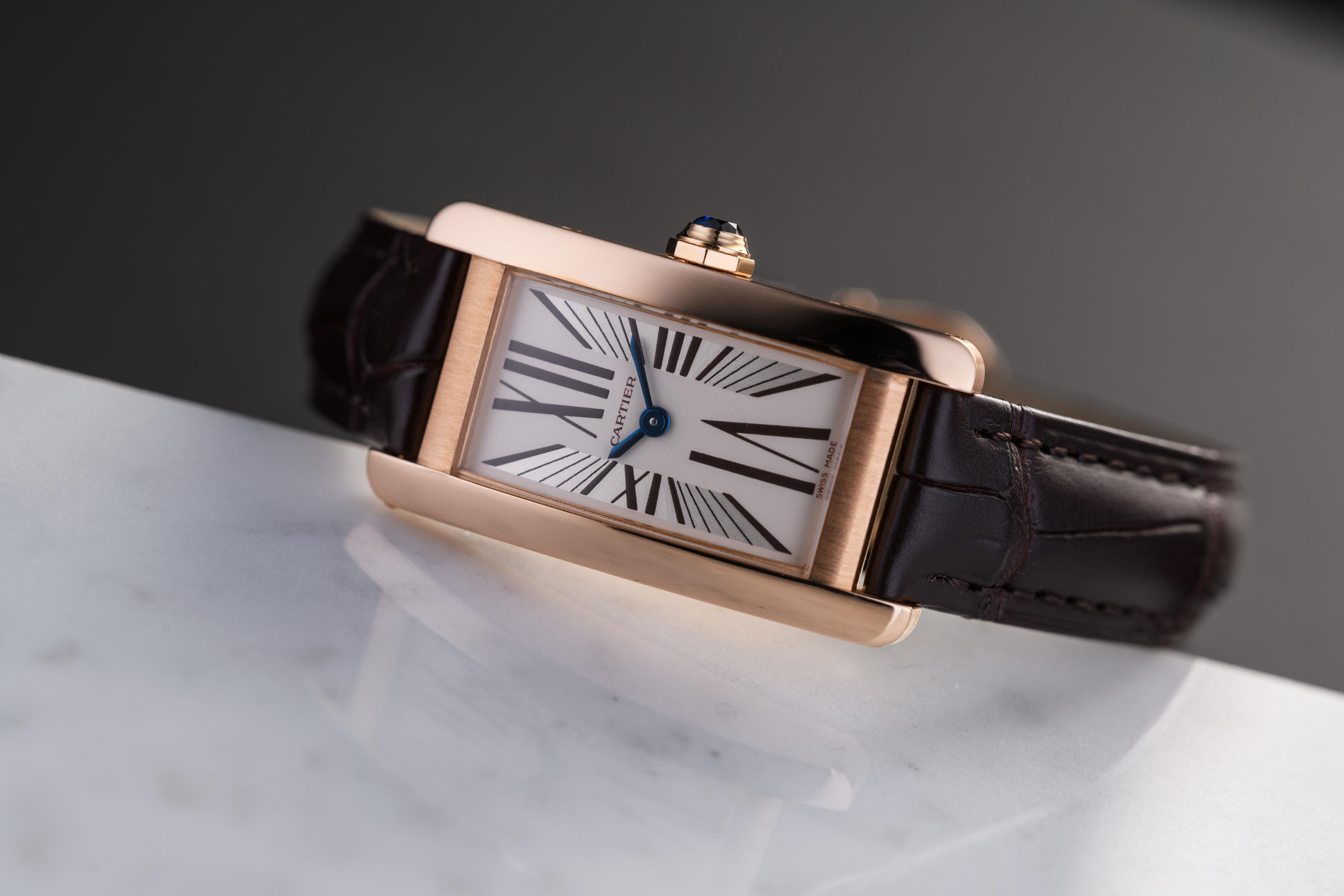 The Tank Américaine has always been an elegant watch in the Cartier collection and this perfect example is no exception. In a 19mm curved rose gold case with matt finished sides and a polished front, it is topped with a sapphire set crown. Sporting