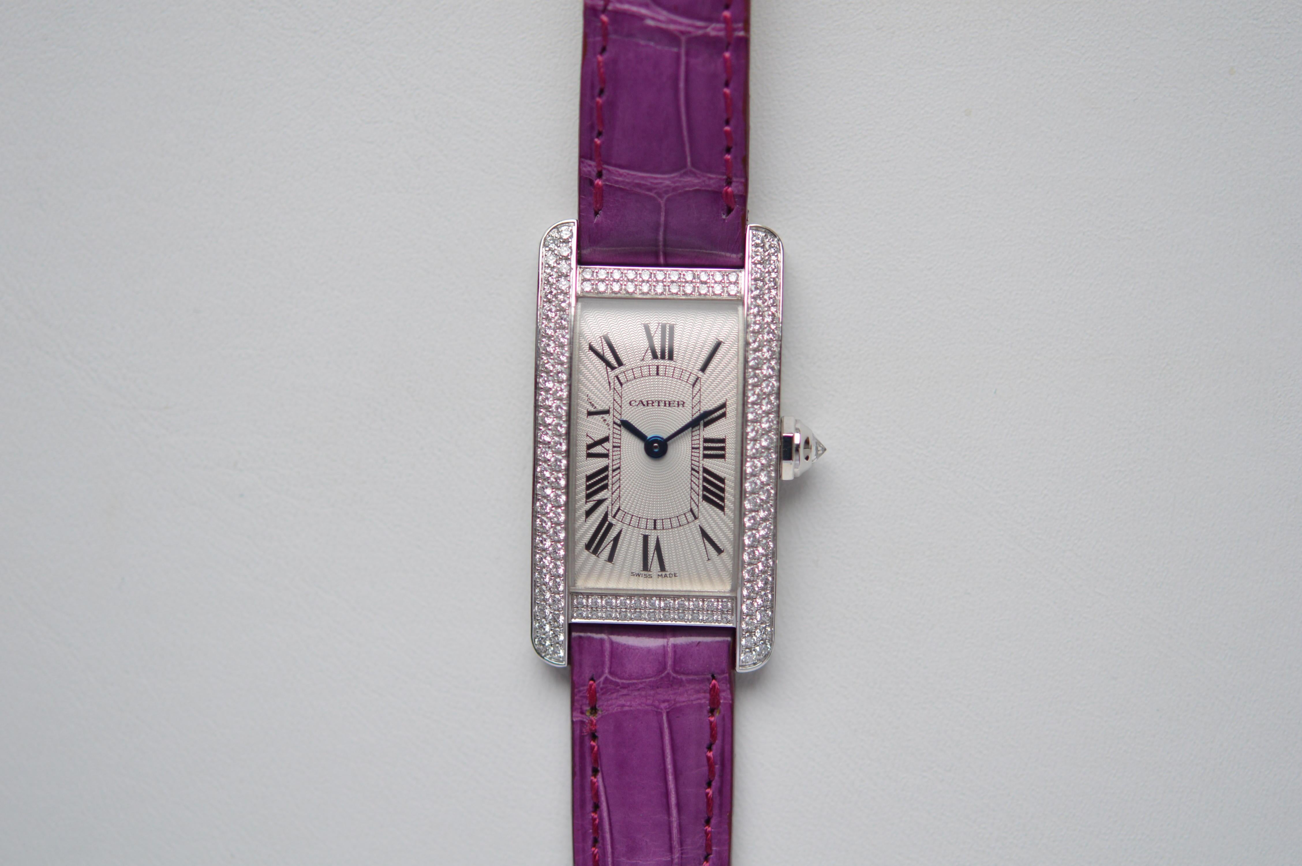 Cartier Tank Americaine
Reference n° WB704431
Small Model (SM) Size
18K White Gold
28mm X 19mm Size
Diamond Bezel
Original Cartier Diamond Setting
143 Round Diamond for a total of 0.94 carats
Diamond Crown
Purple Leather Strap
Silver White