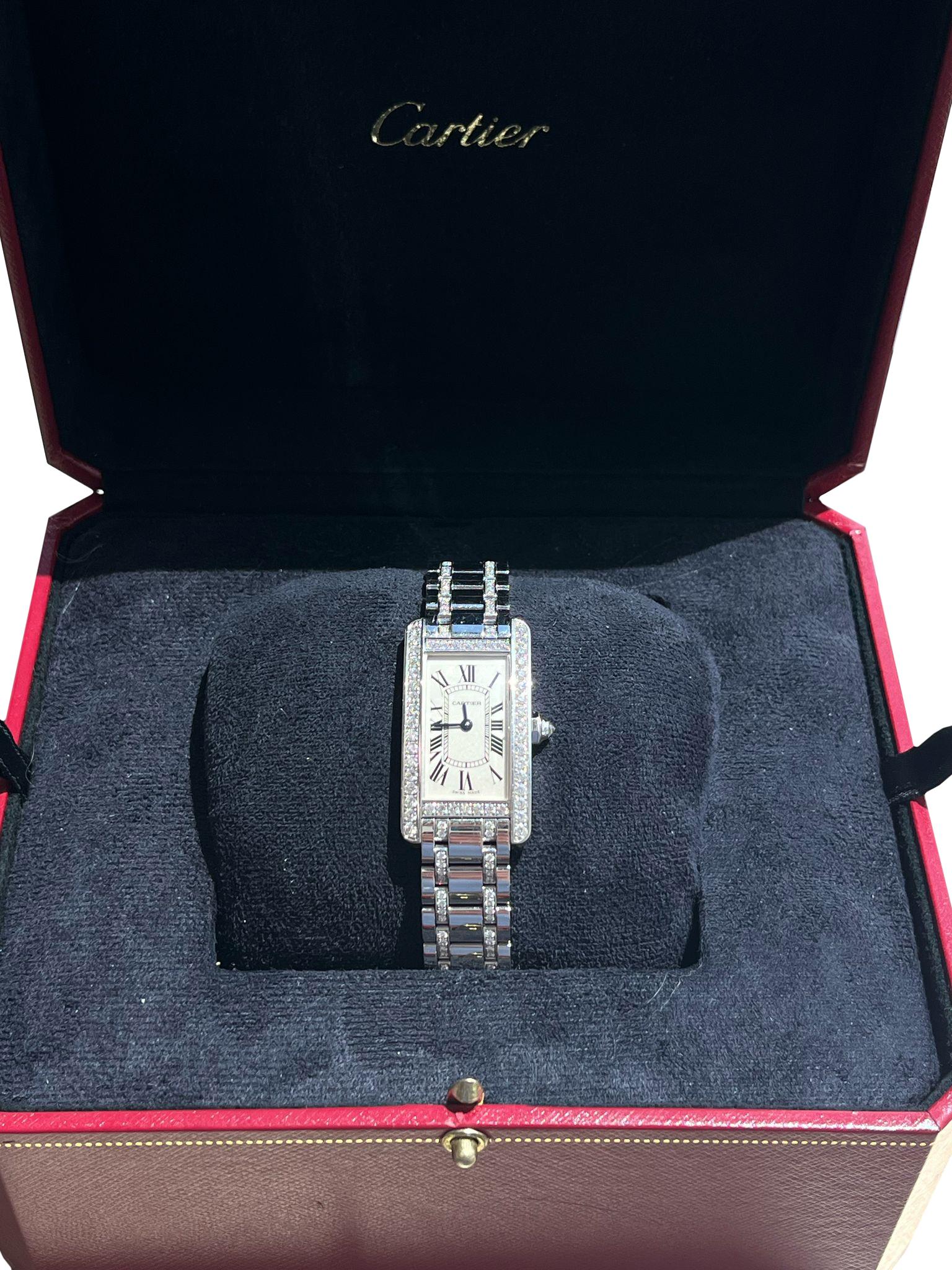 A stunning ladies' Tank Americaine wristwatch crafted in white gold by Cartier. Featuring a White dial with Roman numerals, and blued-steel sword-shaped hands. The dial is a fixed white gold bezel set with round brilliant cut diamonds. Fitted with a