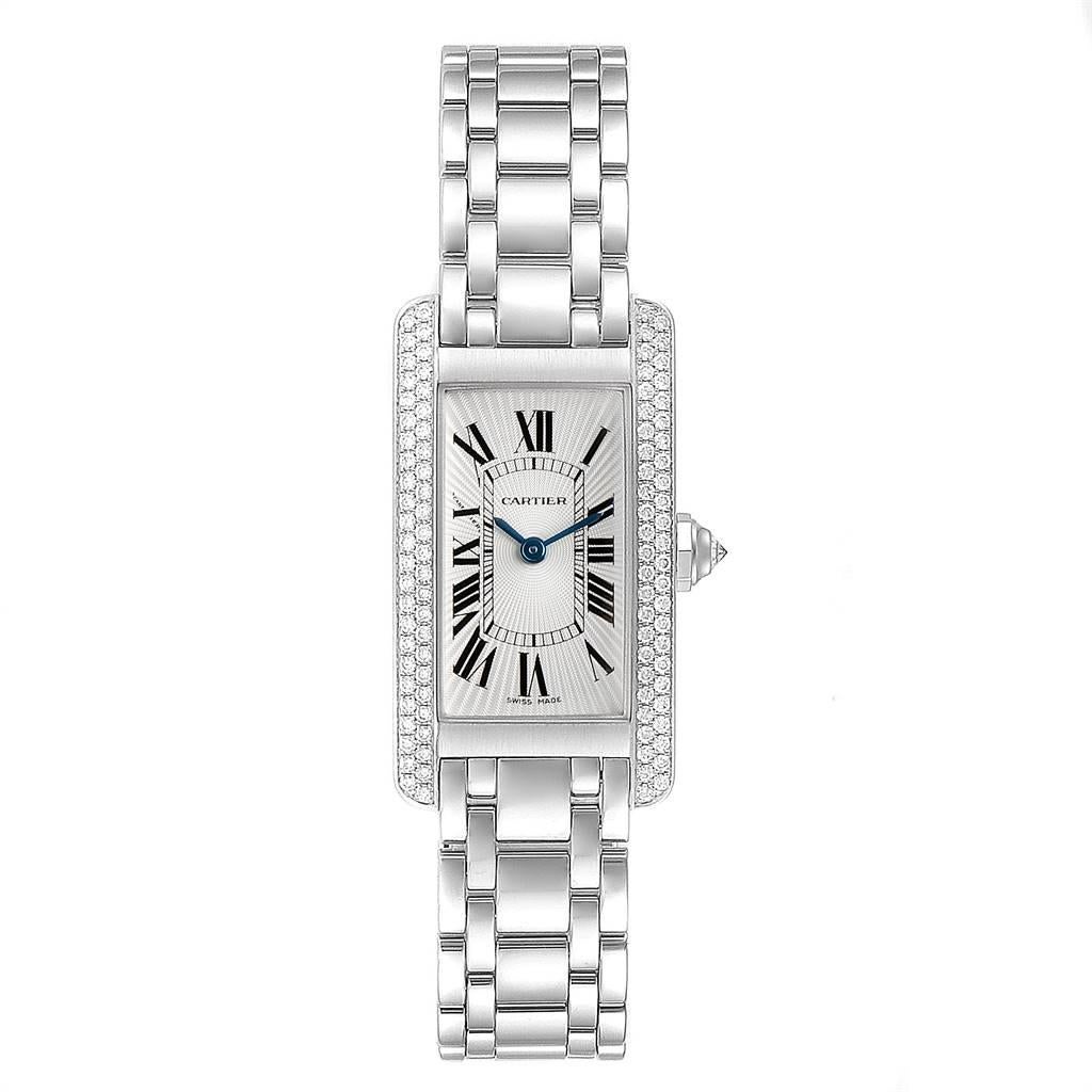 Cartier Tank Americaine White Gold Diamond Ladies Watch WB7018L1. Quartz movement. 18K white gold case 19.0 x 35.0 mm with 2 rows of diamond on the sides. Circular grained crown set with faceted diamond. Scratch resistant sapphire crystal. Silver