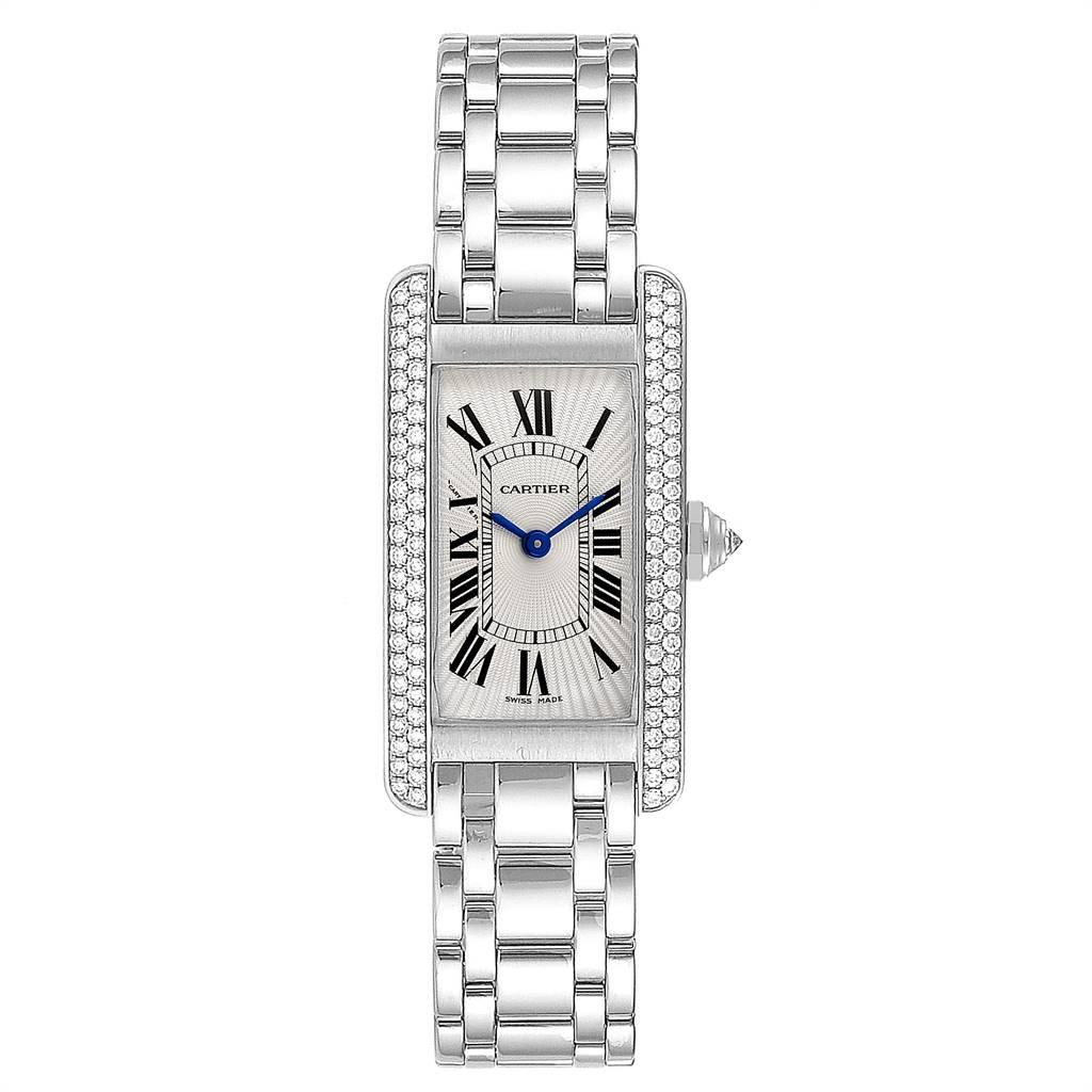 Cartier Tank Americaine White Gold Diamond Ladies Watch WB7018L1. Quartz movement. 18K white gold case 19.0 x 35.0 mm with 2 rows of diamond on the sides. Circular grained crown set with faceted diamond. Scratch resistant sapphire crystal. Silver