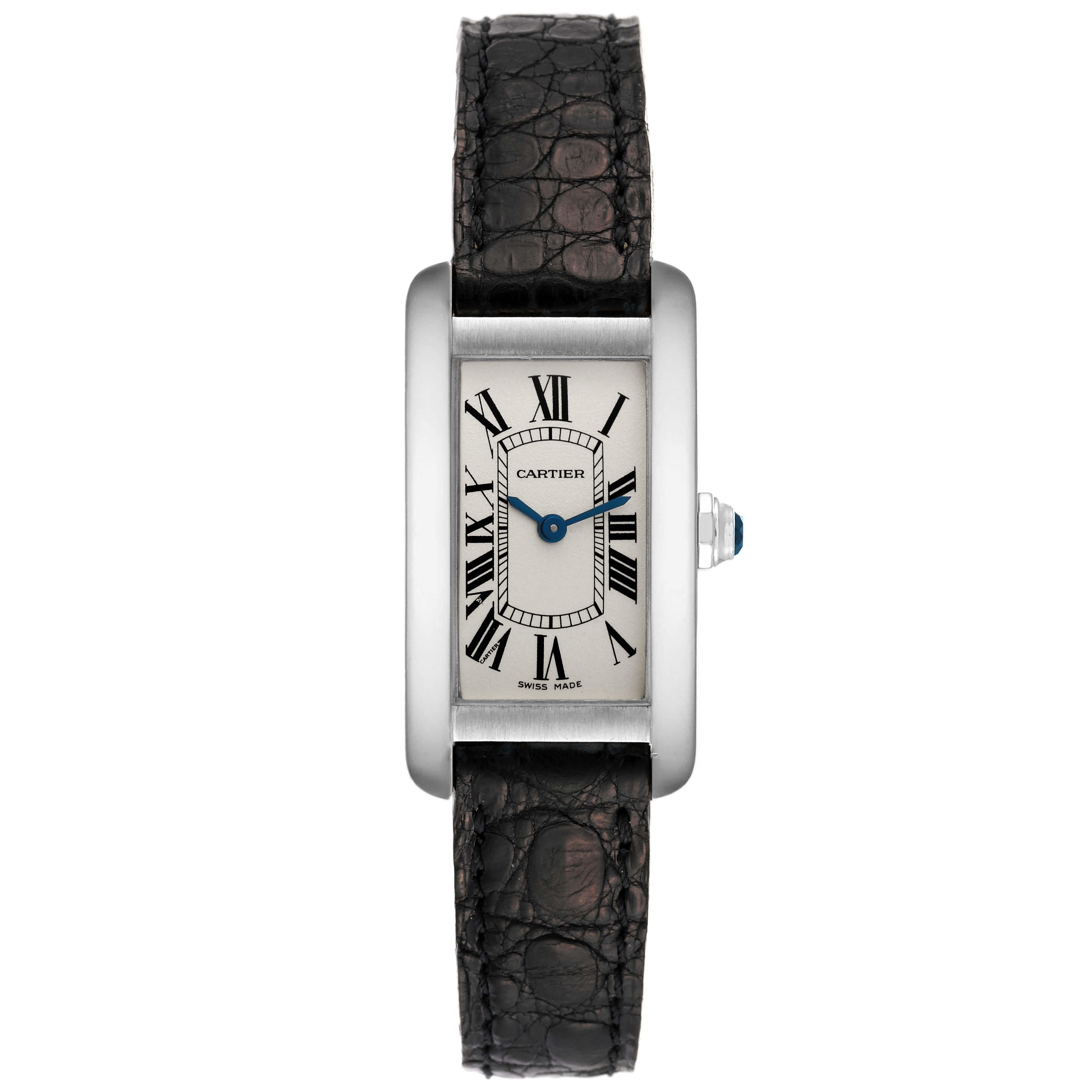 Cartier Tank Americaine White Gold Silver Dial Ladies Watch W2601956. Quartz movement. 18K white gold case 19.0 x 35.0 mm. Octagonal crown set with faceted blue sapphire. . Scratch resistant sapphire crystal. Silvered grained dial with black Roman