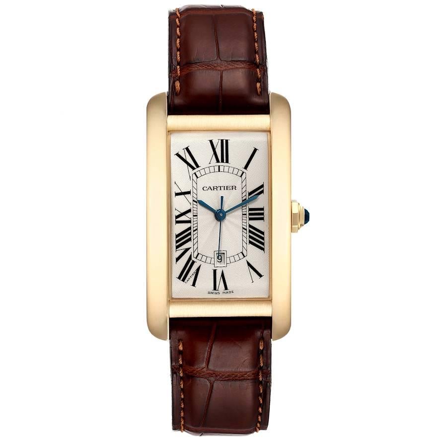 Cartier Tank Americaine Yellow Gold Automatic Mens Watch W2603156. Automatic self-winding movement. 18K yellow gold case 26.6 x 45.1 mm. Circular grained crown set with faceted blue sapphire. . 18K yellow gold case 26.6 x 45.1 mm. Circular grained